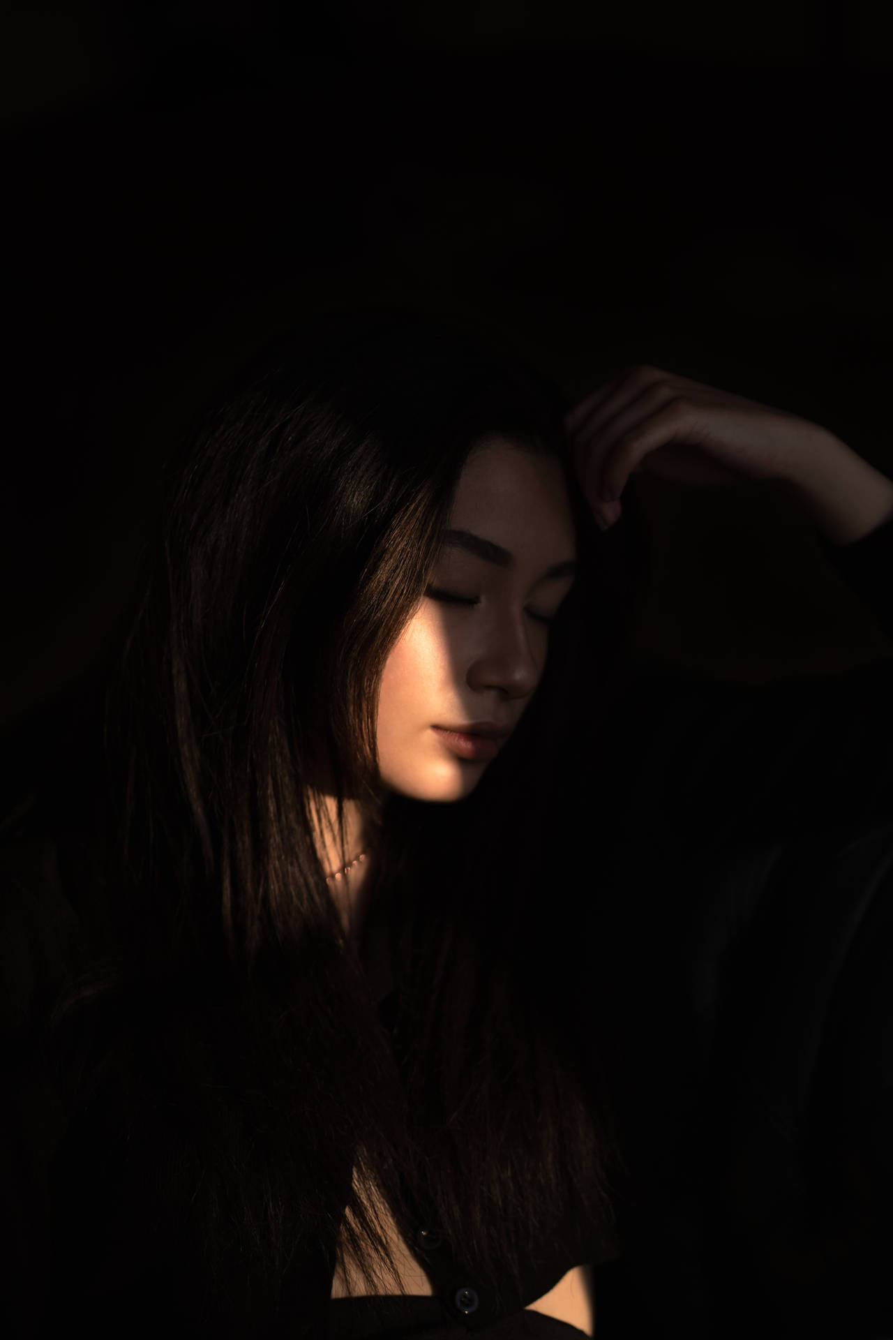 Caption: Elegant Dark-skinned Girl Illuminated By Sunlight Background