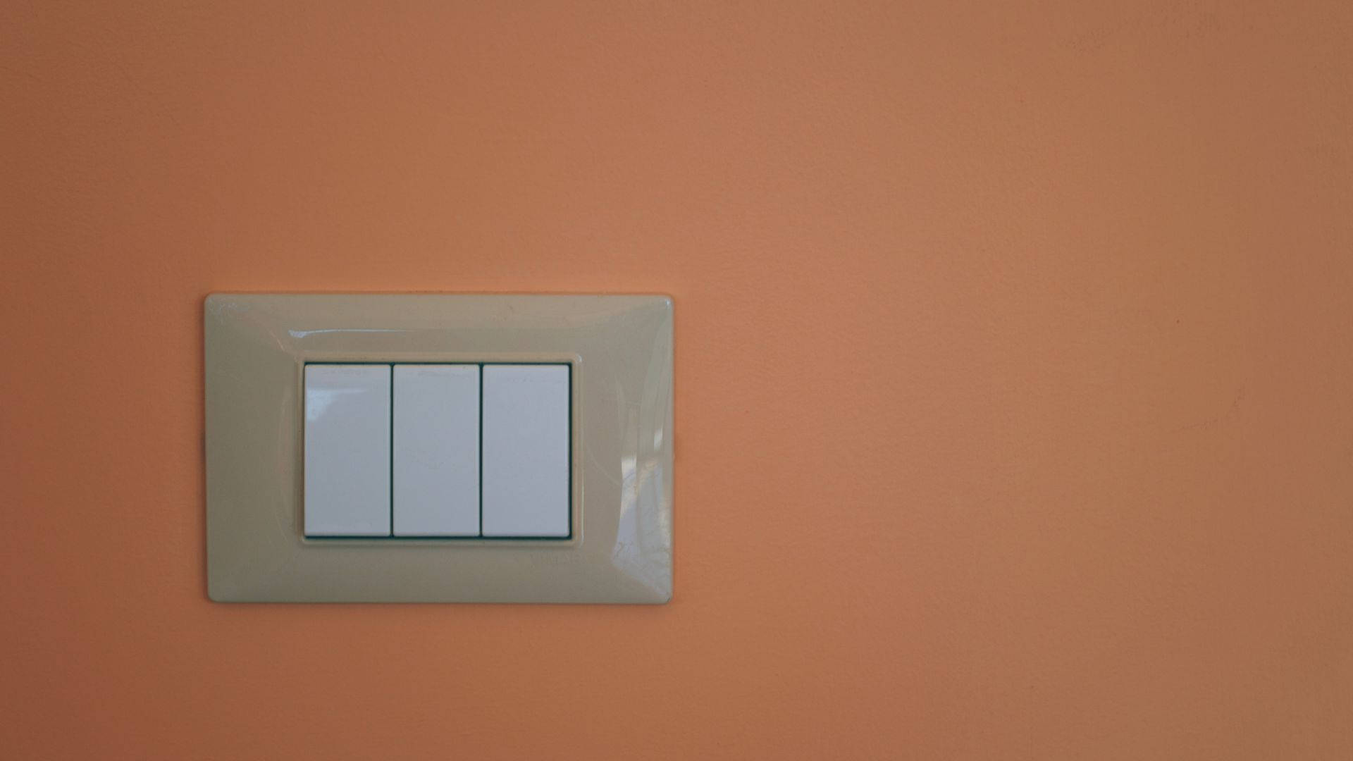 Caption: Elegant European Light Switch Cover Background