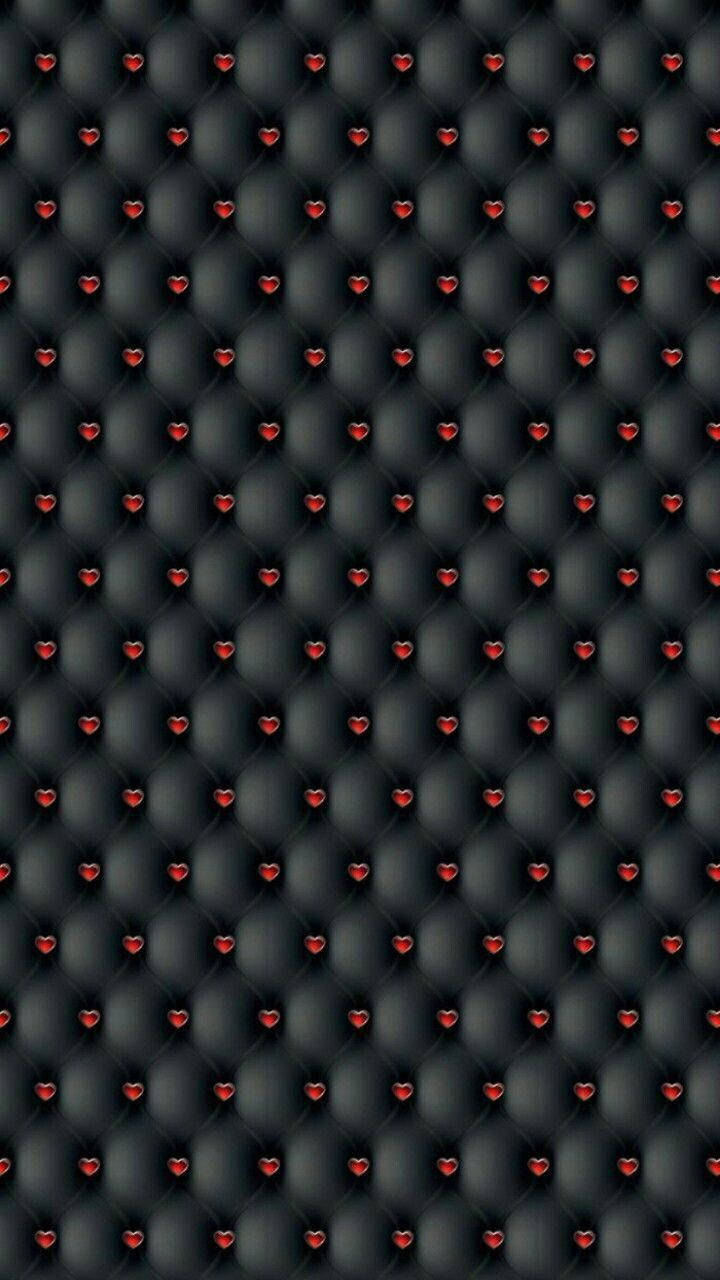 Caption: Elegant Heart-pattern On Black Leather For Iphone Background Background