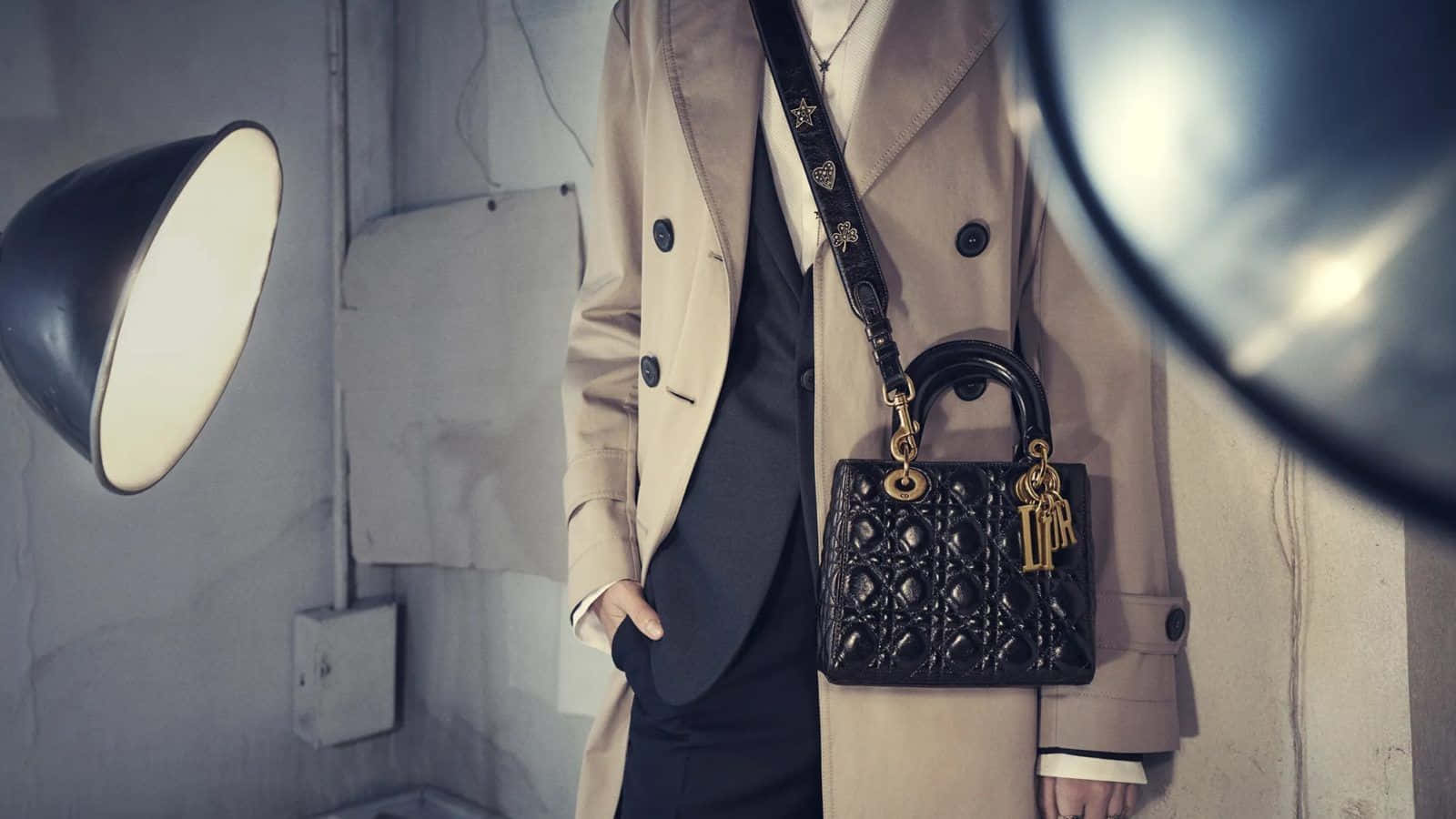 Caption: Elegant Lady Dior Handbag Background