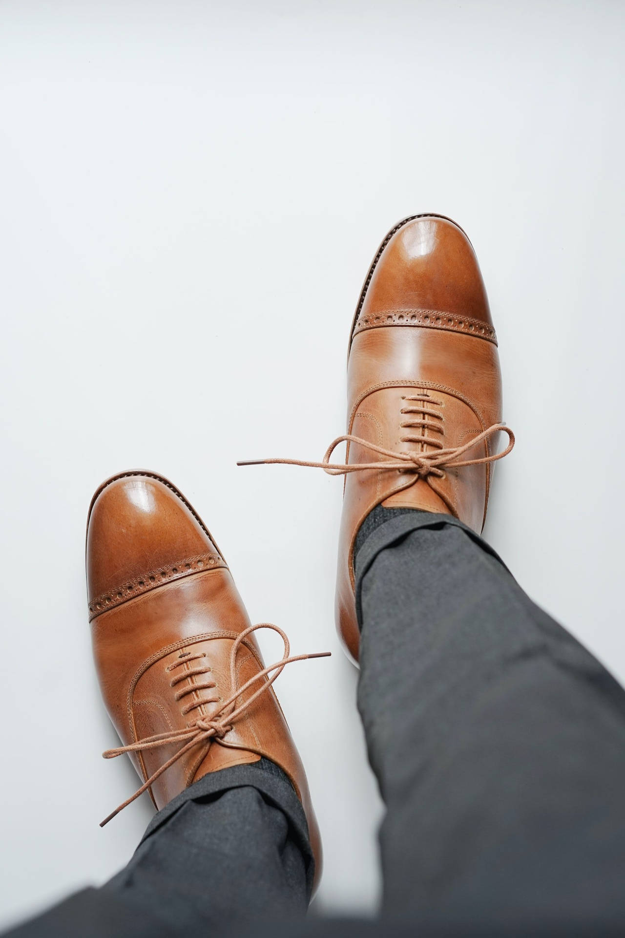 Caption: Elegant Paul Stuart Brown Dress Shoes Background