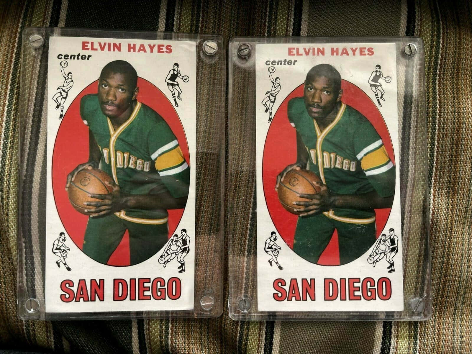Caption: Elvin Hayes, A Legendary Professional Basketball Player In Action On The Court Background