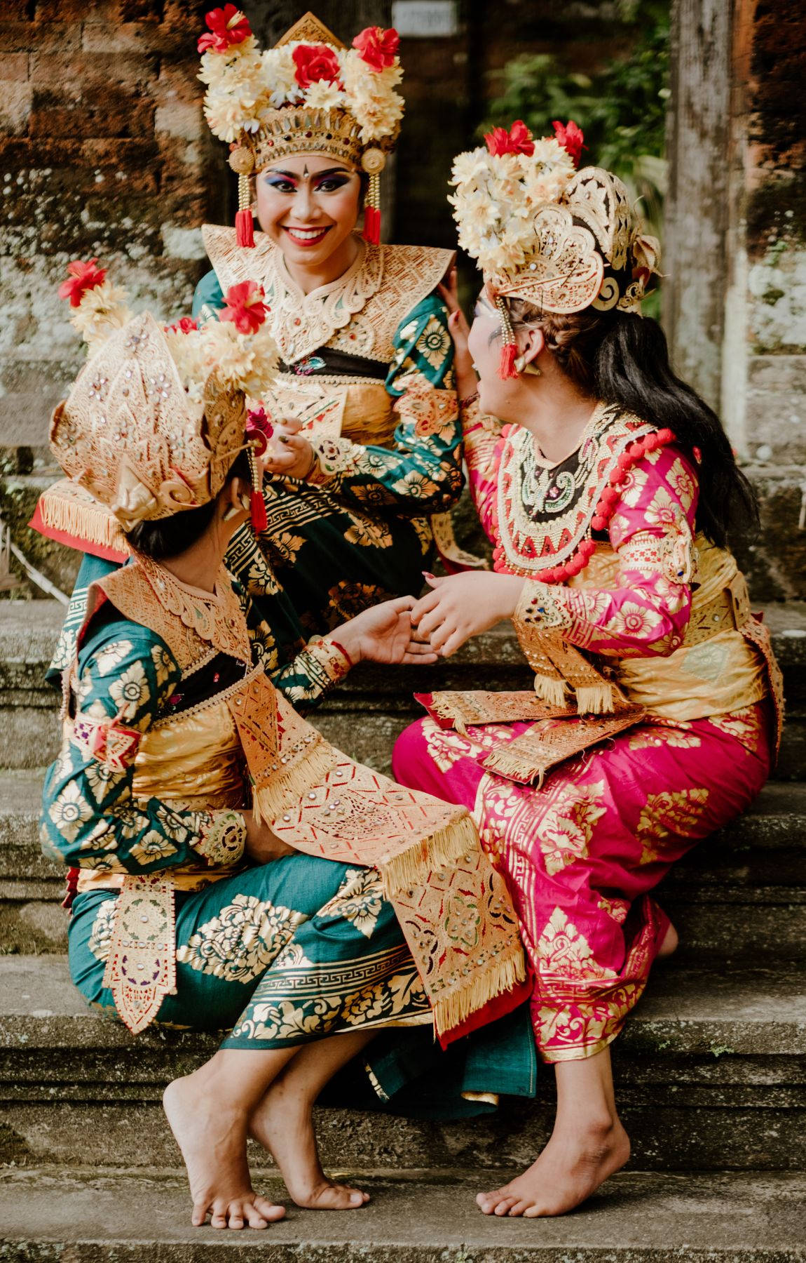 Caption: Embodying Bali Culture Through Traditional Attire Background