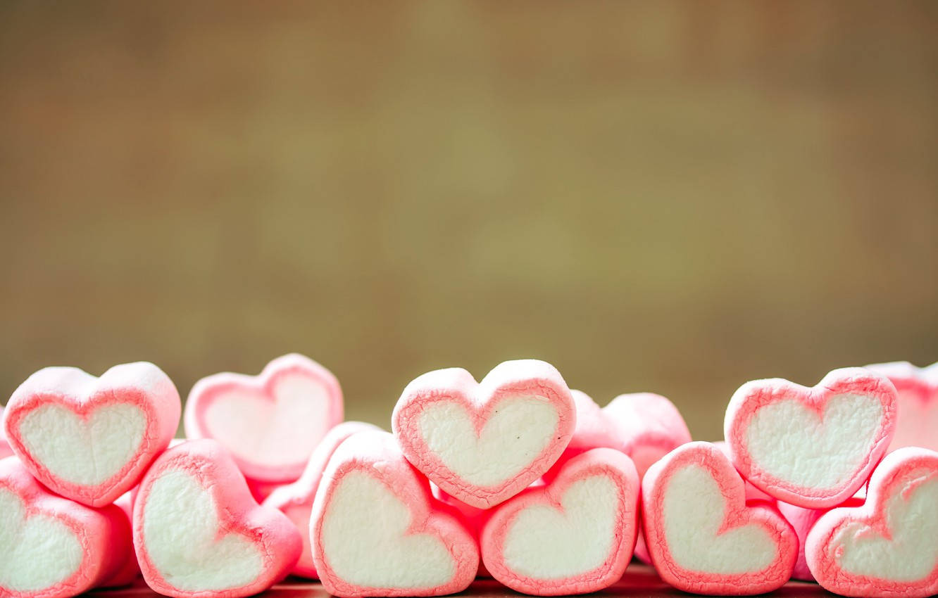 Caption: Enchanting 3d Marshmallow Hearts Lined Up In Perfect Harmony Background