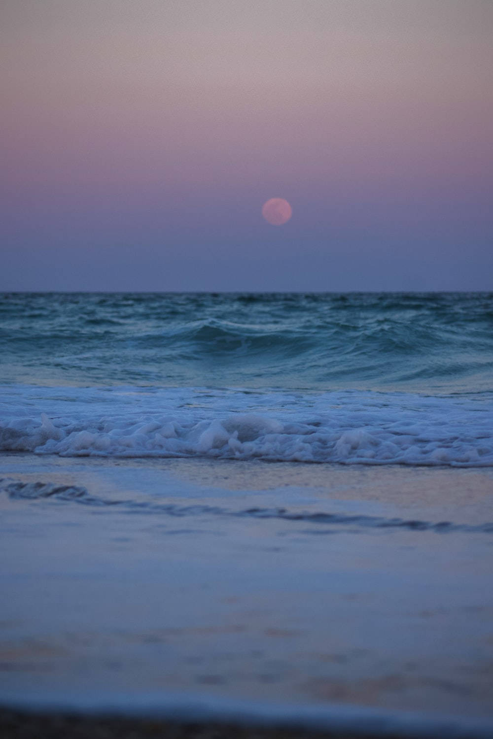 Caption: Enchanting Serenity - A Calm Aesthetic Beach At Night.