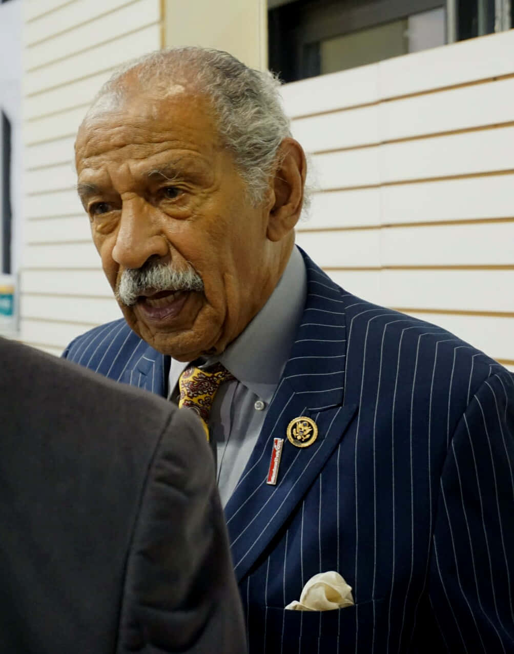 Caption: Engrossed John Conyers During A Public Event Background