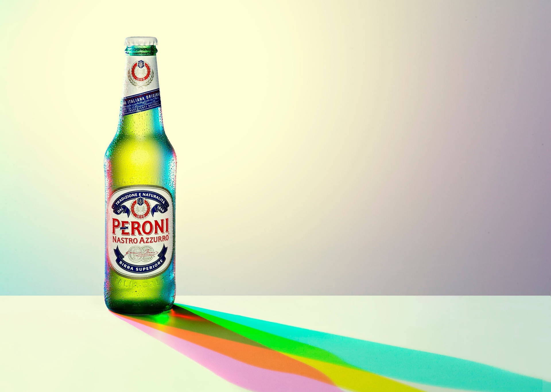 Caption: Enjoying A Chilled Peroni Beer At Sunset Background