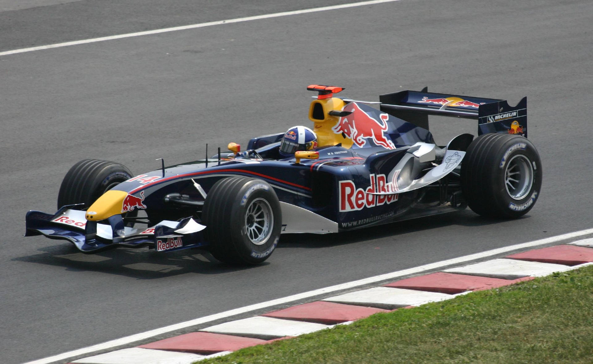 Caption: Exciting Turn Peak - Red Bull Racing With Coulthard Background