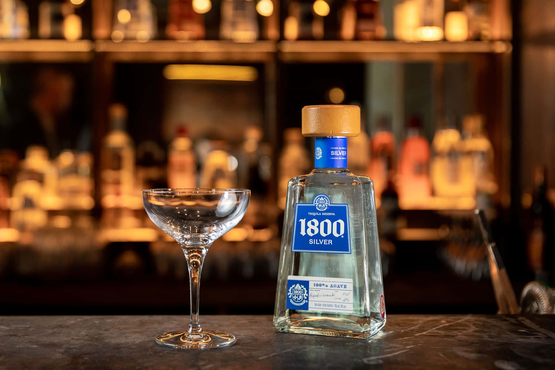 Caption: Exquisite 1800 Tequila Reserva Silver On Bar Countertop Background