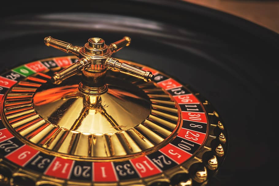 Caption: Exquisite Roulette Wheel In Action Background