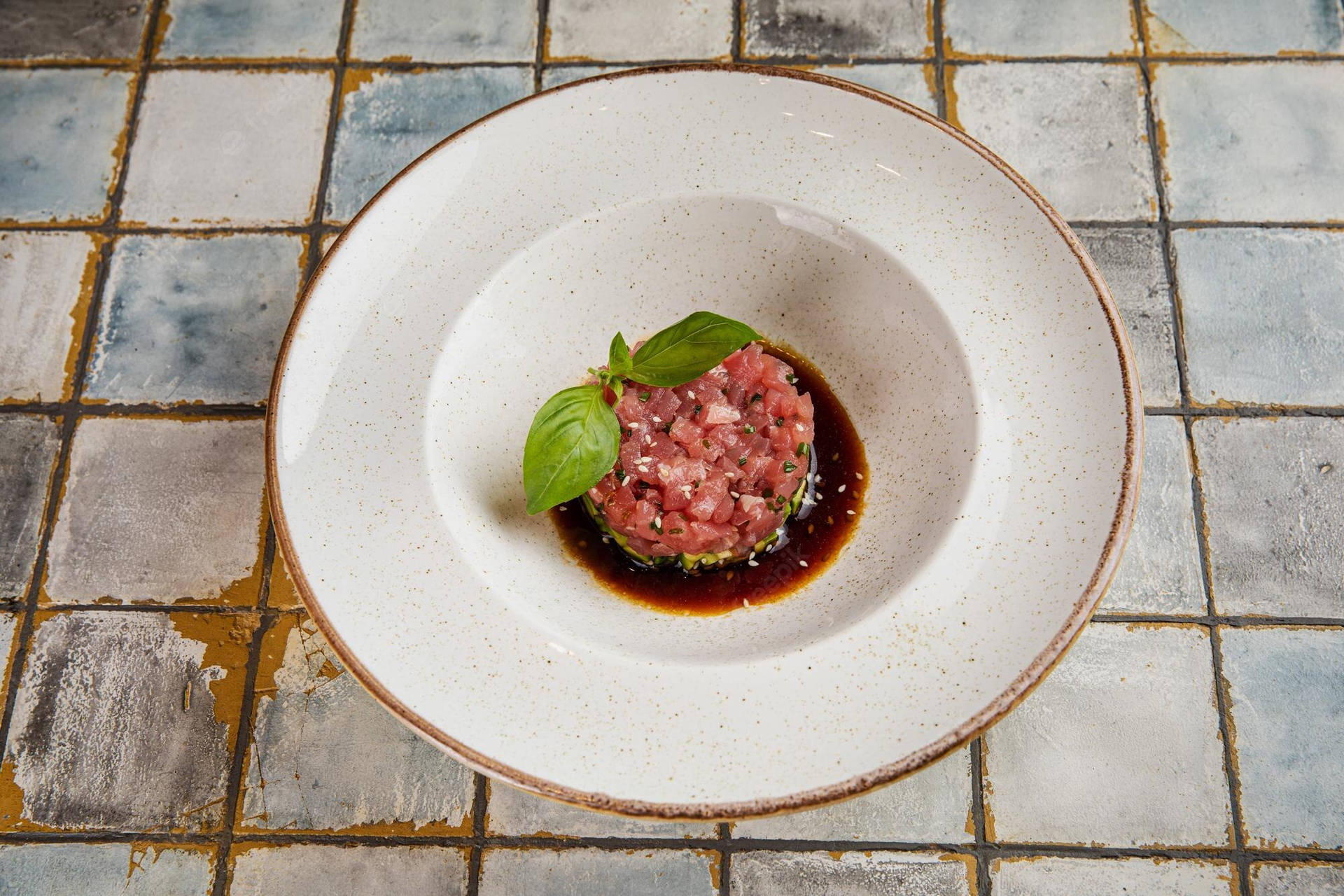 Caption: Exquisite Steak Tartare With Fresh Herbs And Savory Sauce