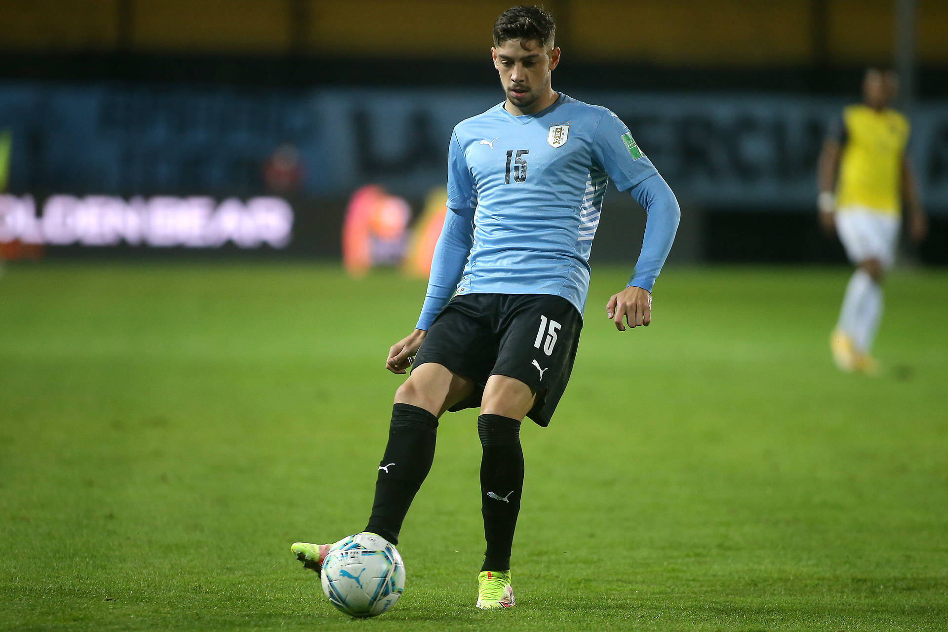 Caption: Federico Valverde In Action For The Uruguay National Football Team Background