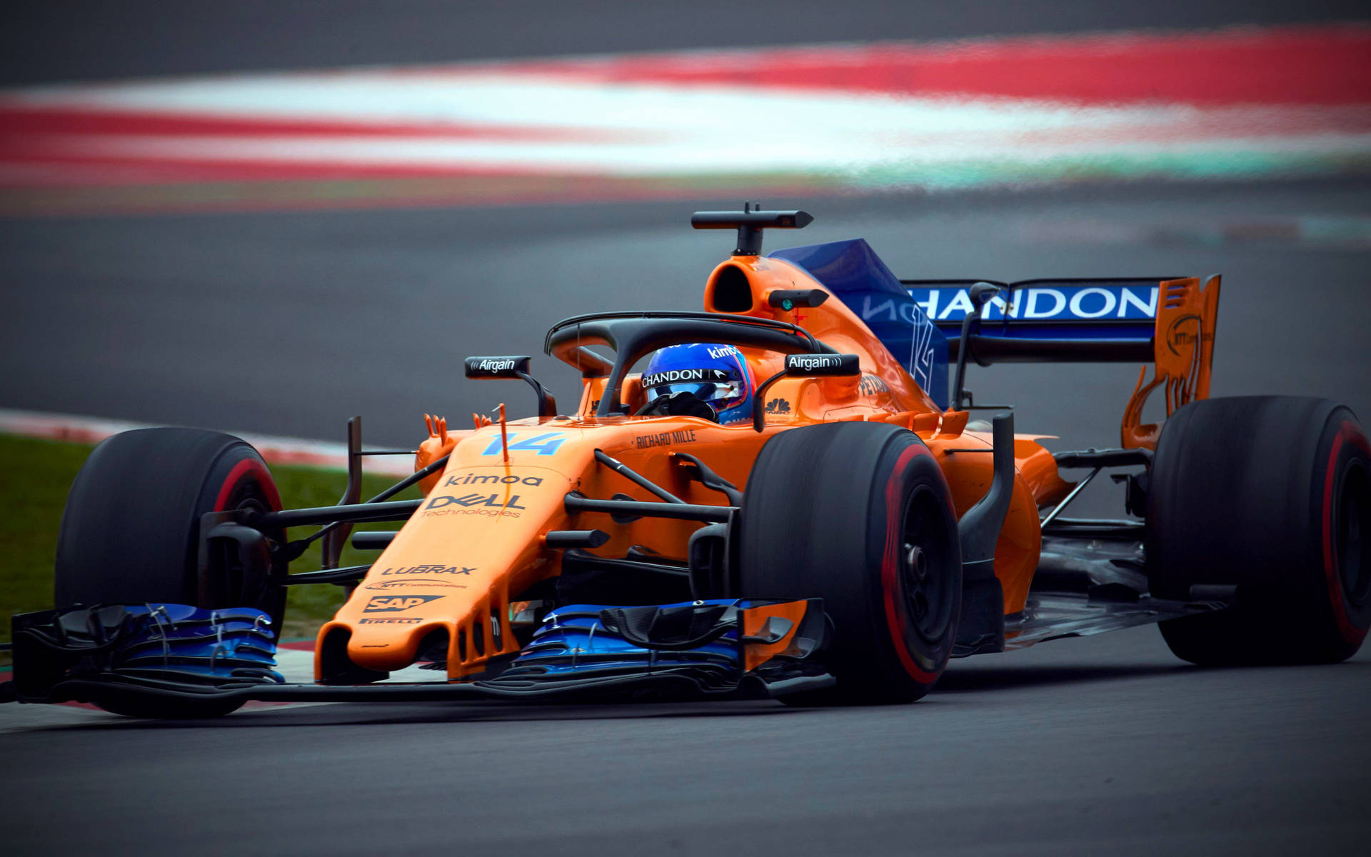 Caption: Fernando Alonso Racing In Orange Mclaren