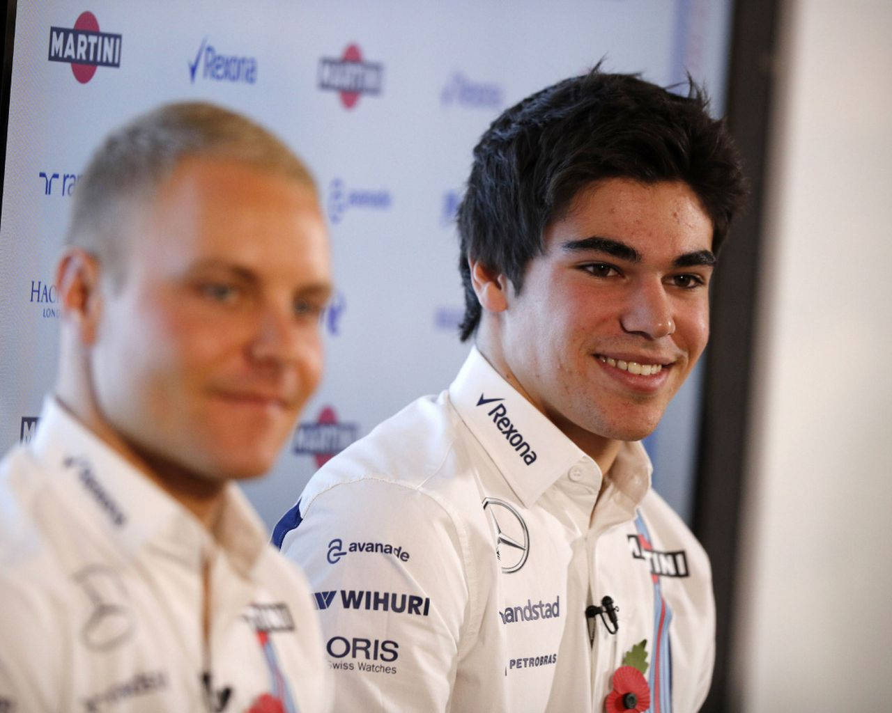 Caption: Fierce Competition: Lance Stroll And Valterri Bottas In Close Contest Background