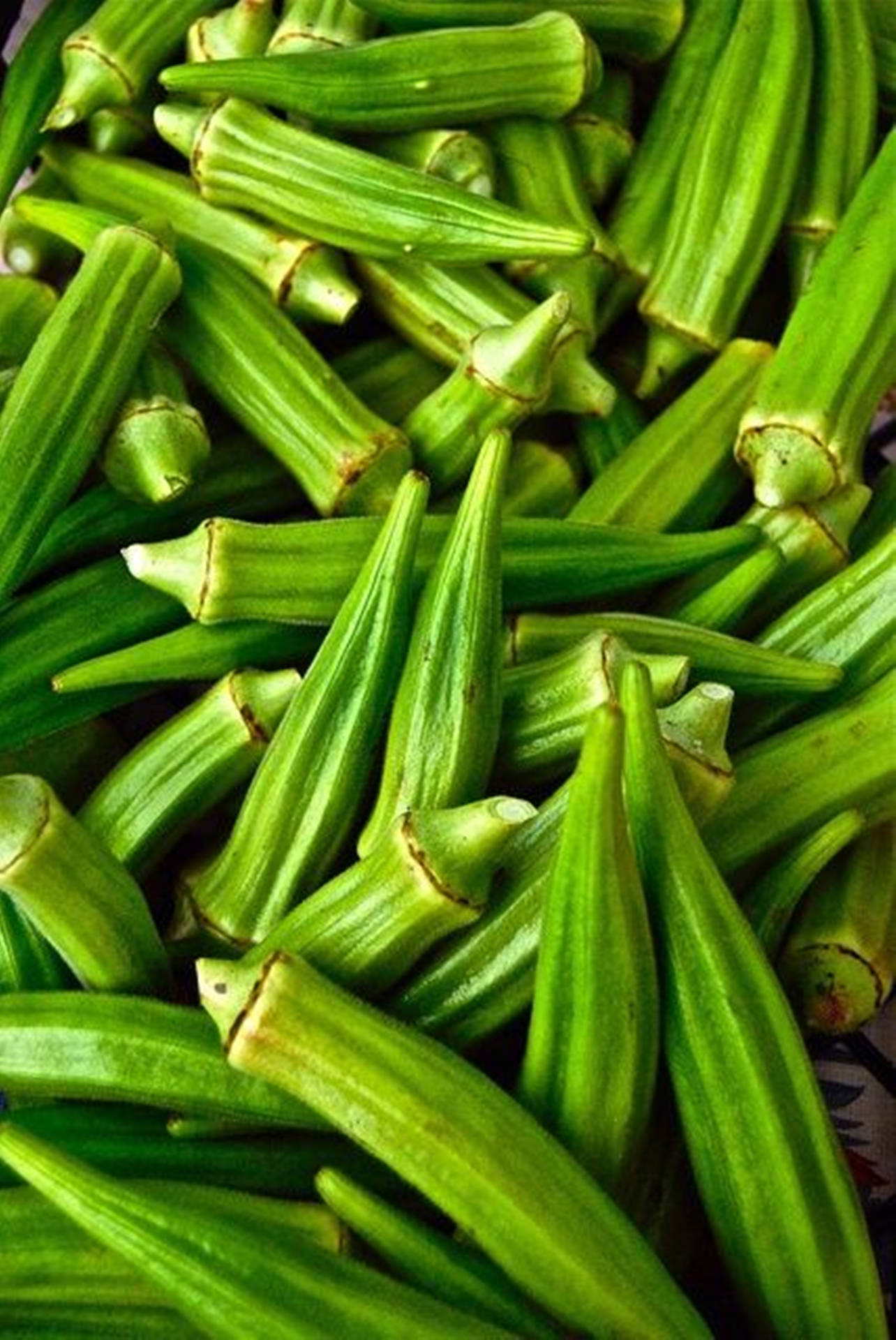 Caption: Fresh Green Okra Up Close Background