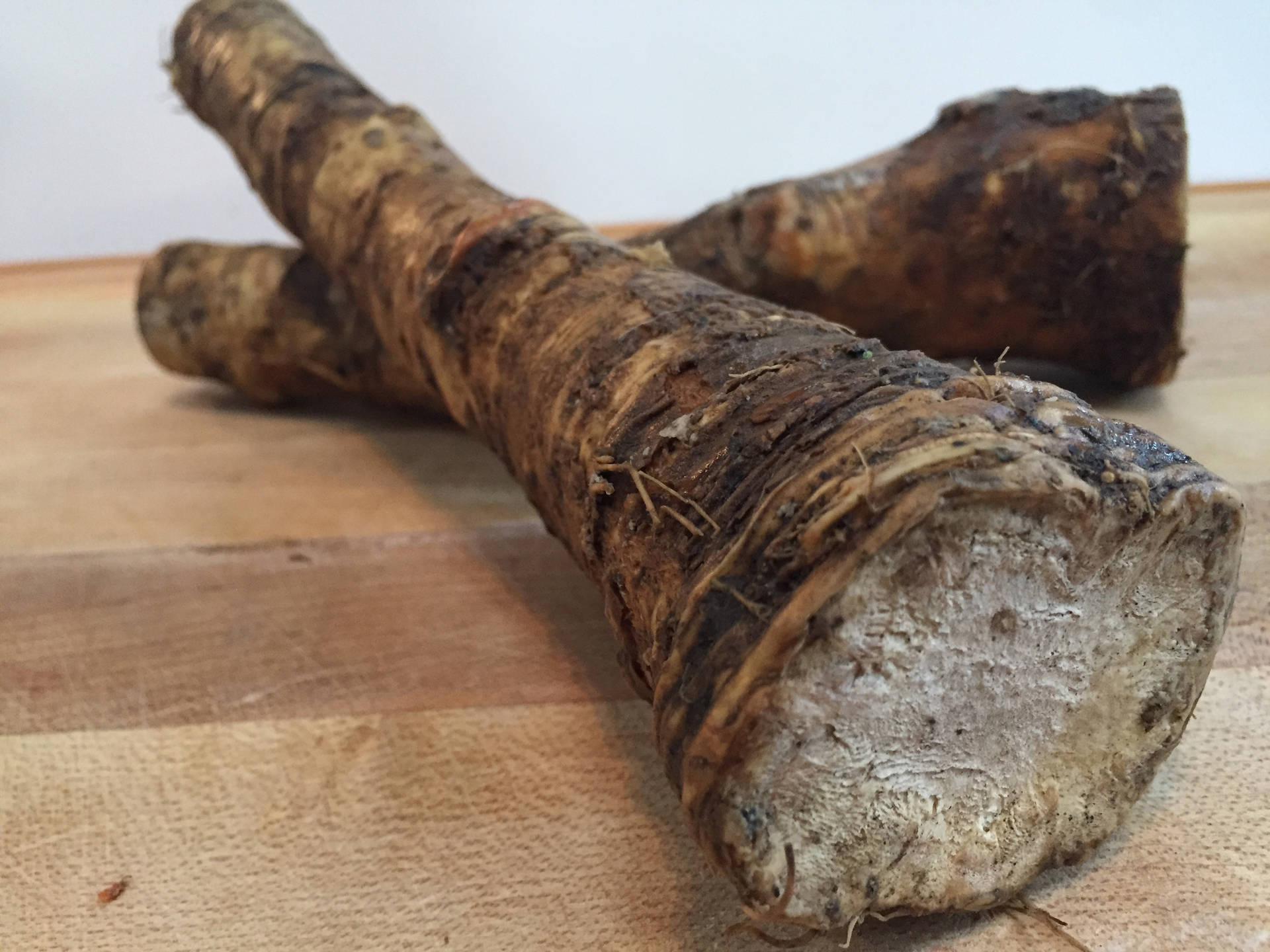 Caption: Fresh Horseradish Root On A Dark Background Background