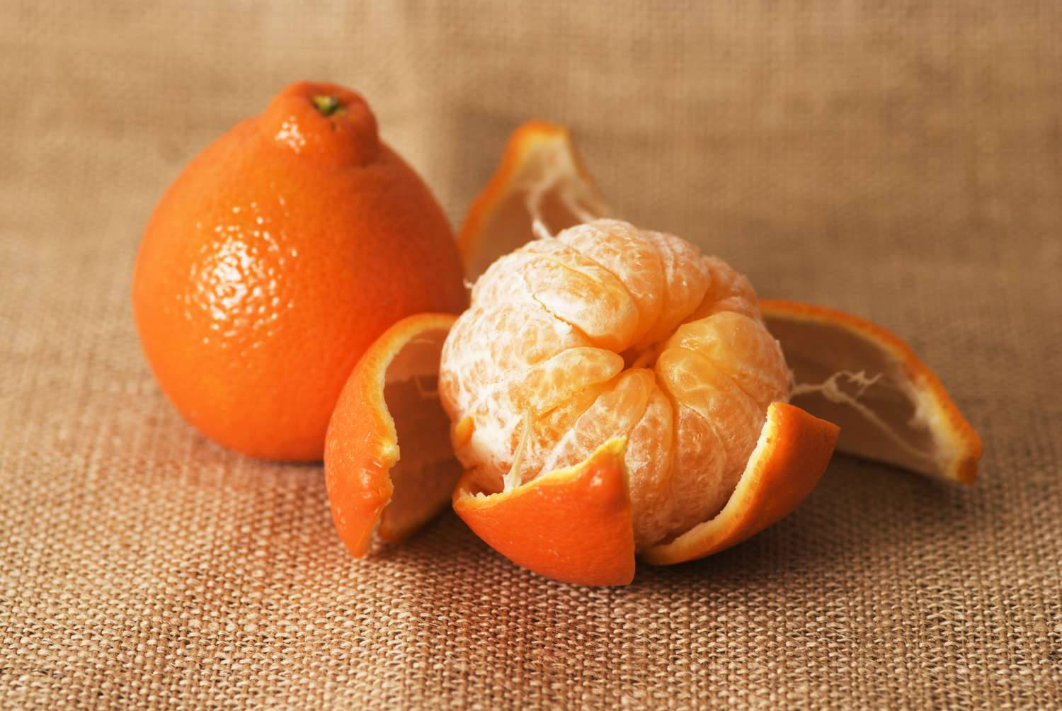 Caption: Fresh Tangelo Fruit On A Knitted Cloth