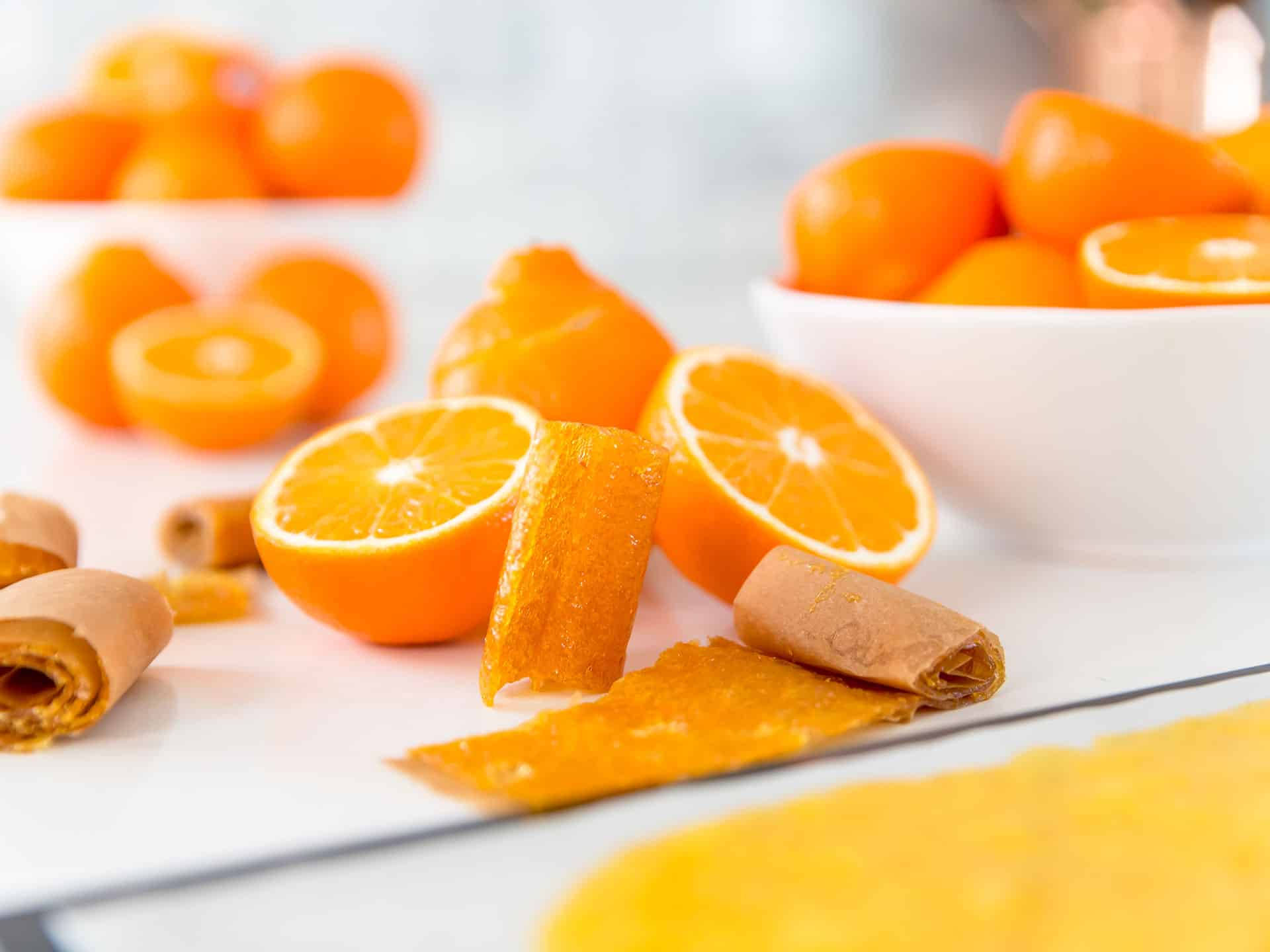 Caption: Fresh Tangelo Fruit Rolls On A White Background Background