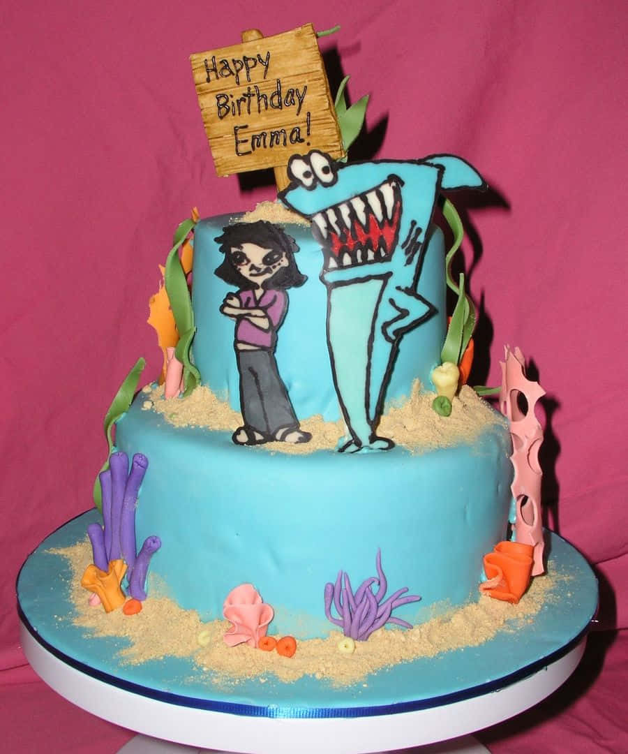 Caption: Fun And Vibrant Kenny The Shark Themed Cake Background