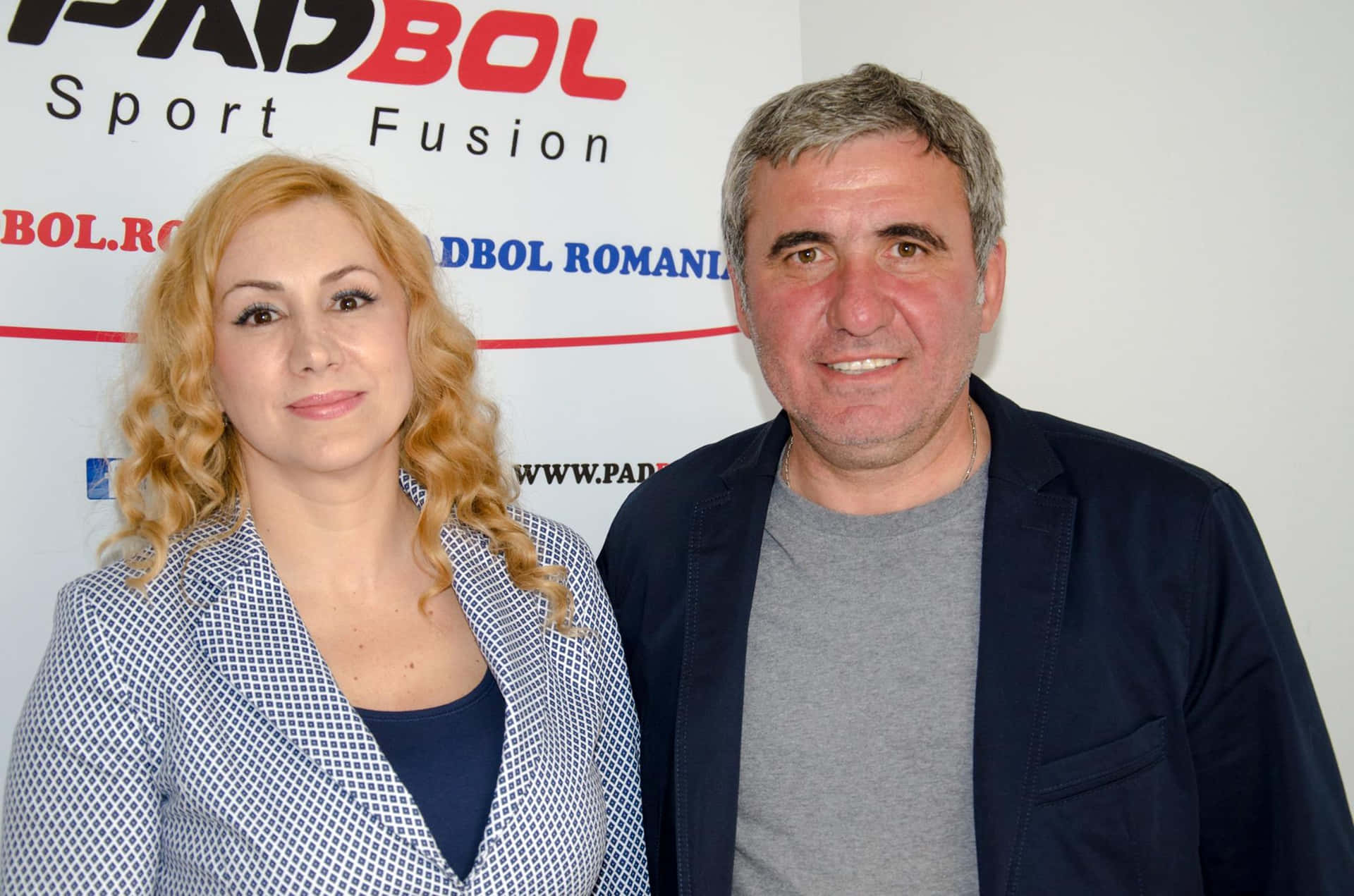 Caption: Gheorghe Hagi With Elisabeta Gherghisan In A Candid Moment Background