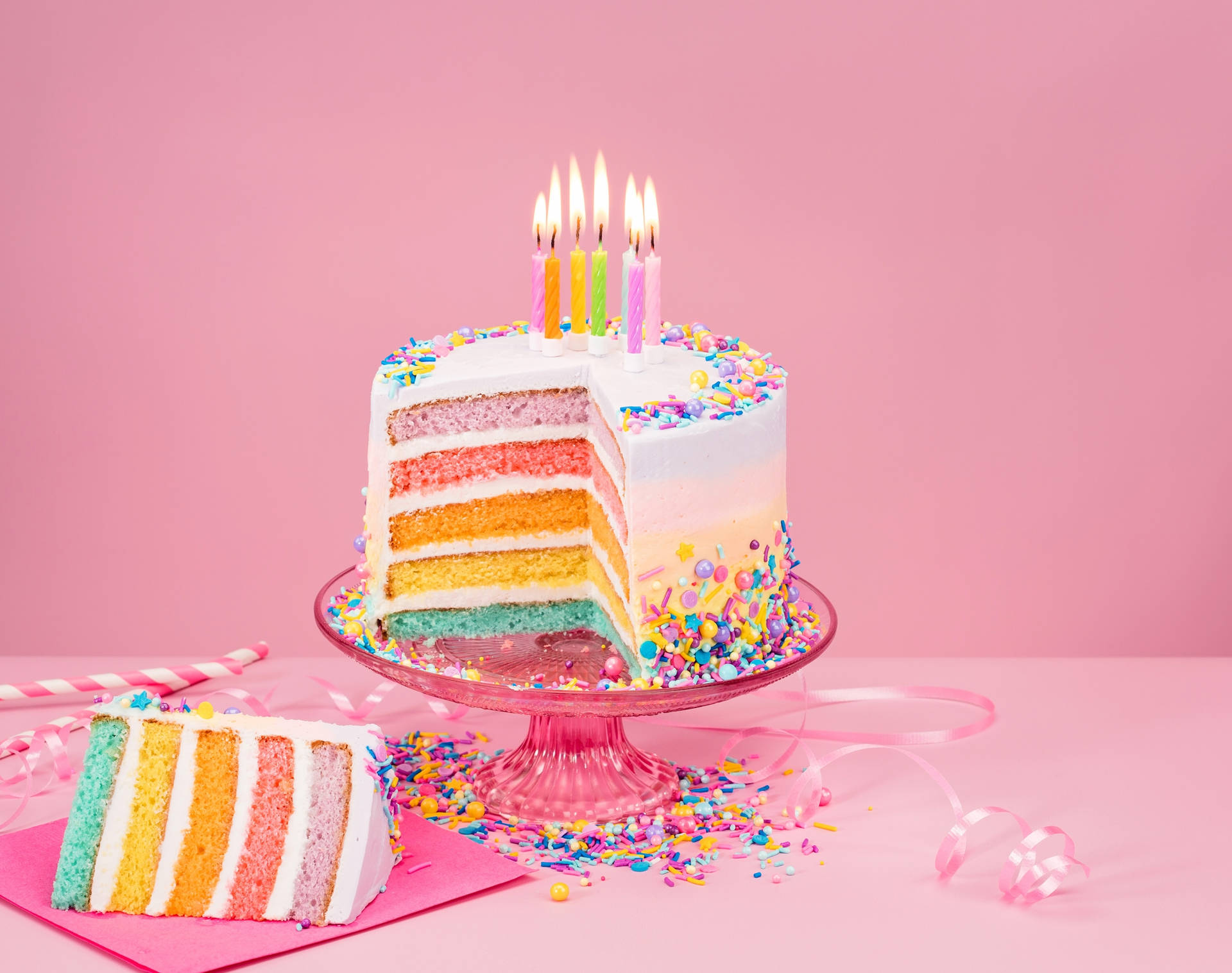 Caption: Glamorous Pastel Birthday Cake With Candles Background