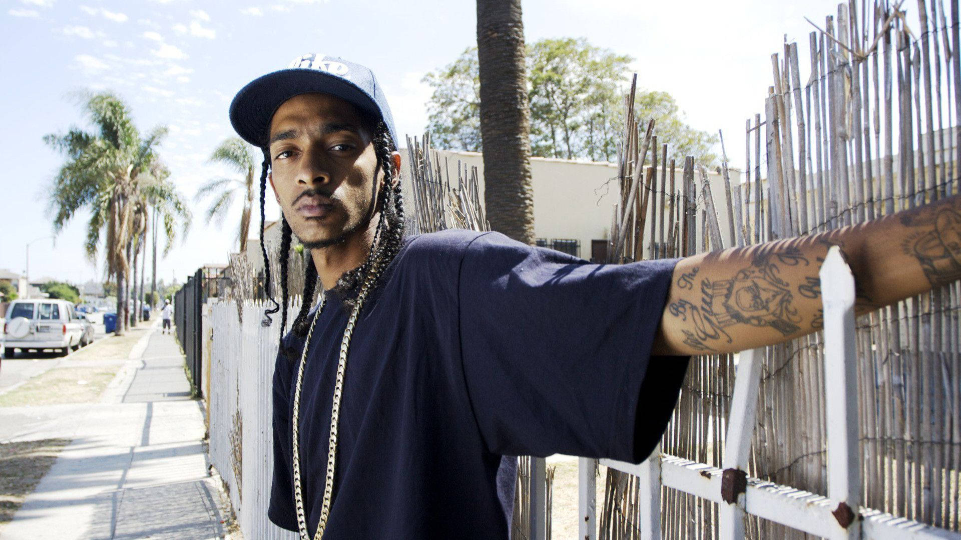 Caption: Grammy-winning Rapper Nipsey Hussle In Concert Background