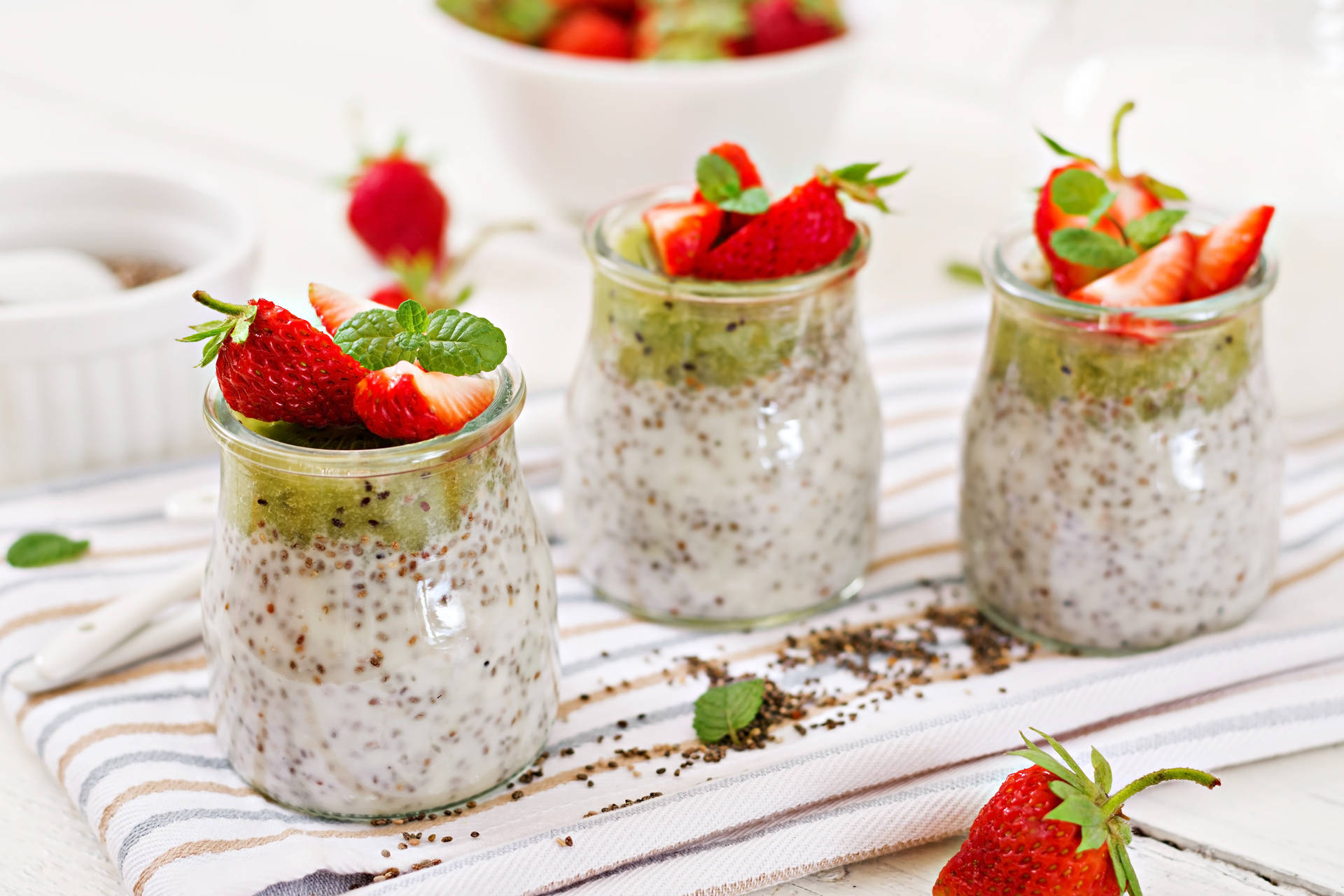 Caption: Health-oriented Yogurt With Fresh Kiwi And Strawberries Background