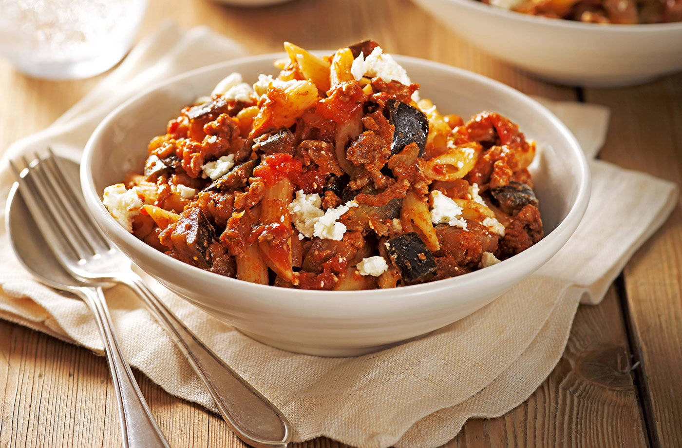 Caption: Hearty And Savory Mixed Moussaka In A Bowl Background