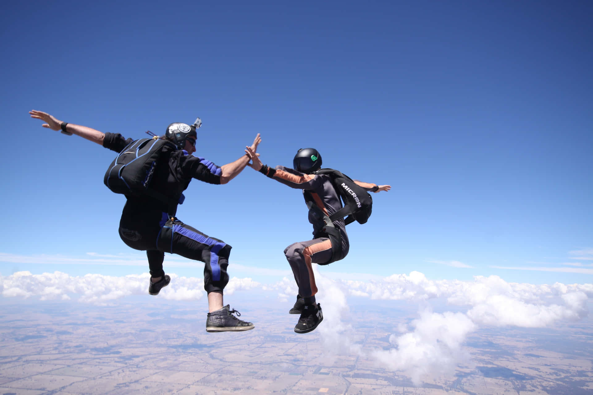 Caption: High-five In The Sky - Skydiving Adventure Background