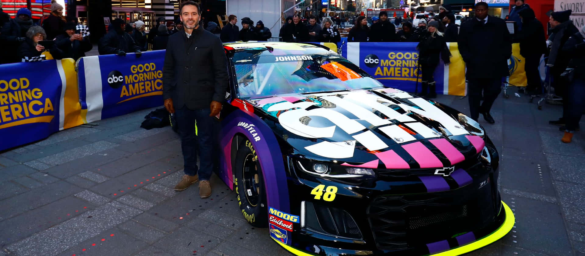 Caption: High Octane Action: Jimmie Johnson In Full Throttle Background