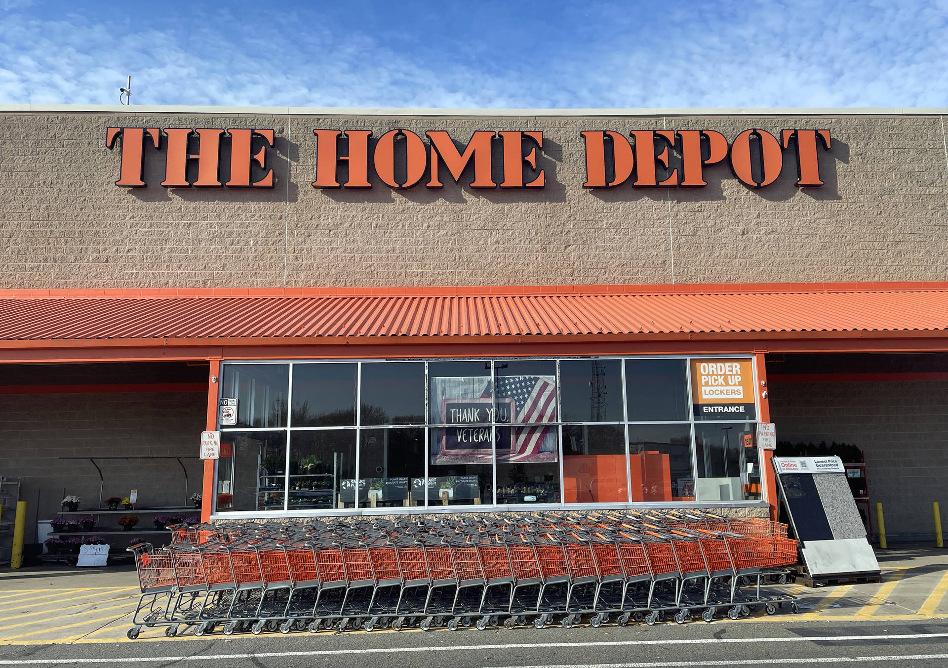 Caption: Home Depot Shopping Carts Stacked Together Background