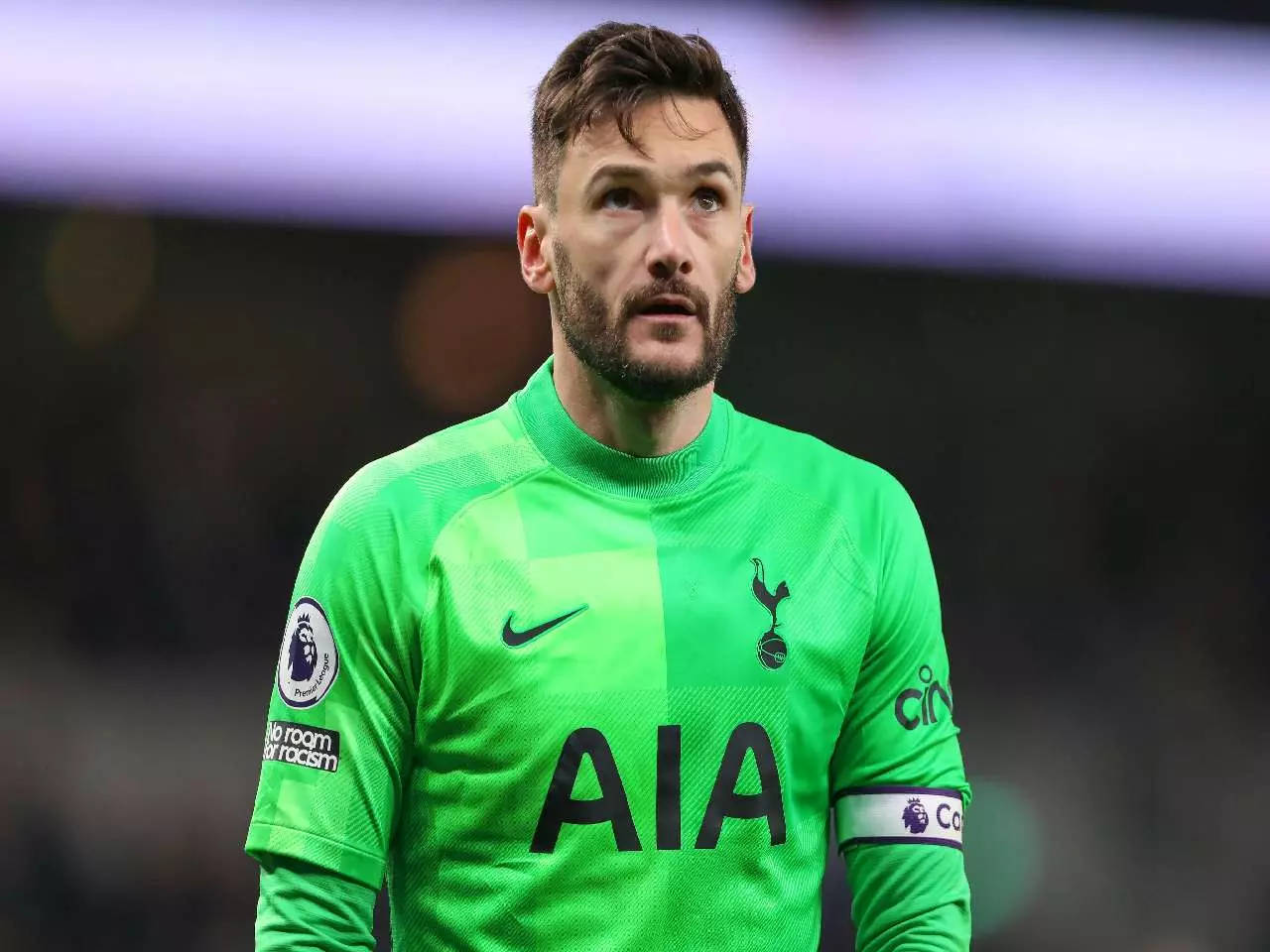 Caption: Hugo Lloris In Action With His Green Jersey Background