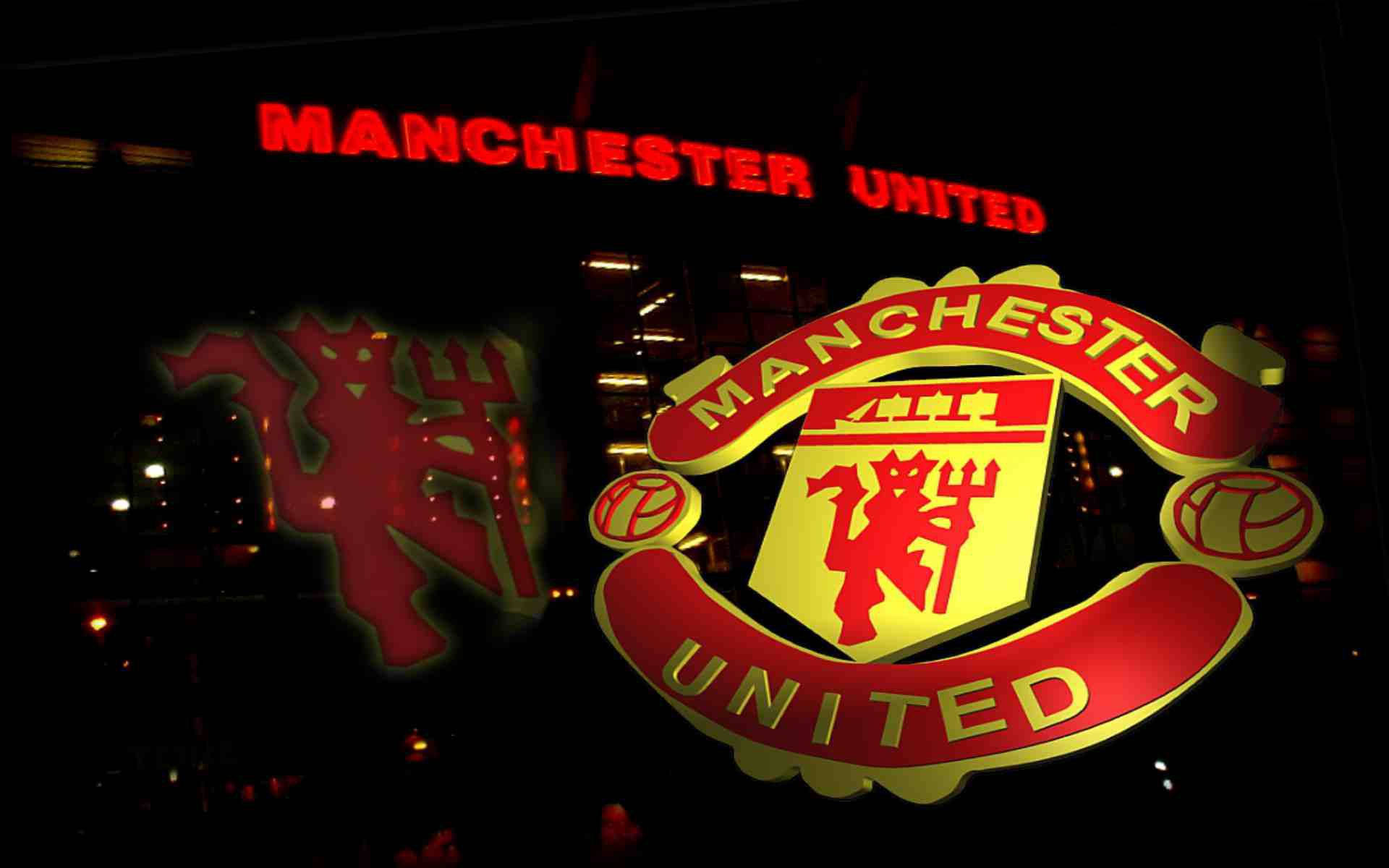Caption: Iconic Manchester United Logo Background