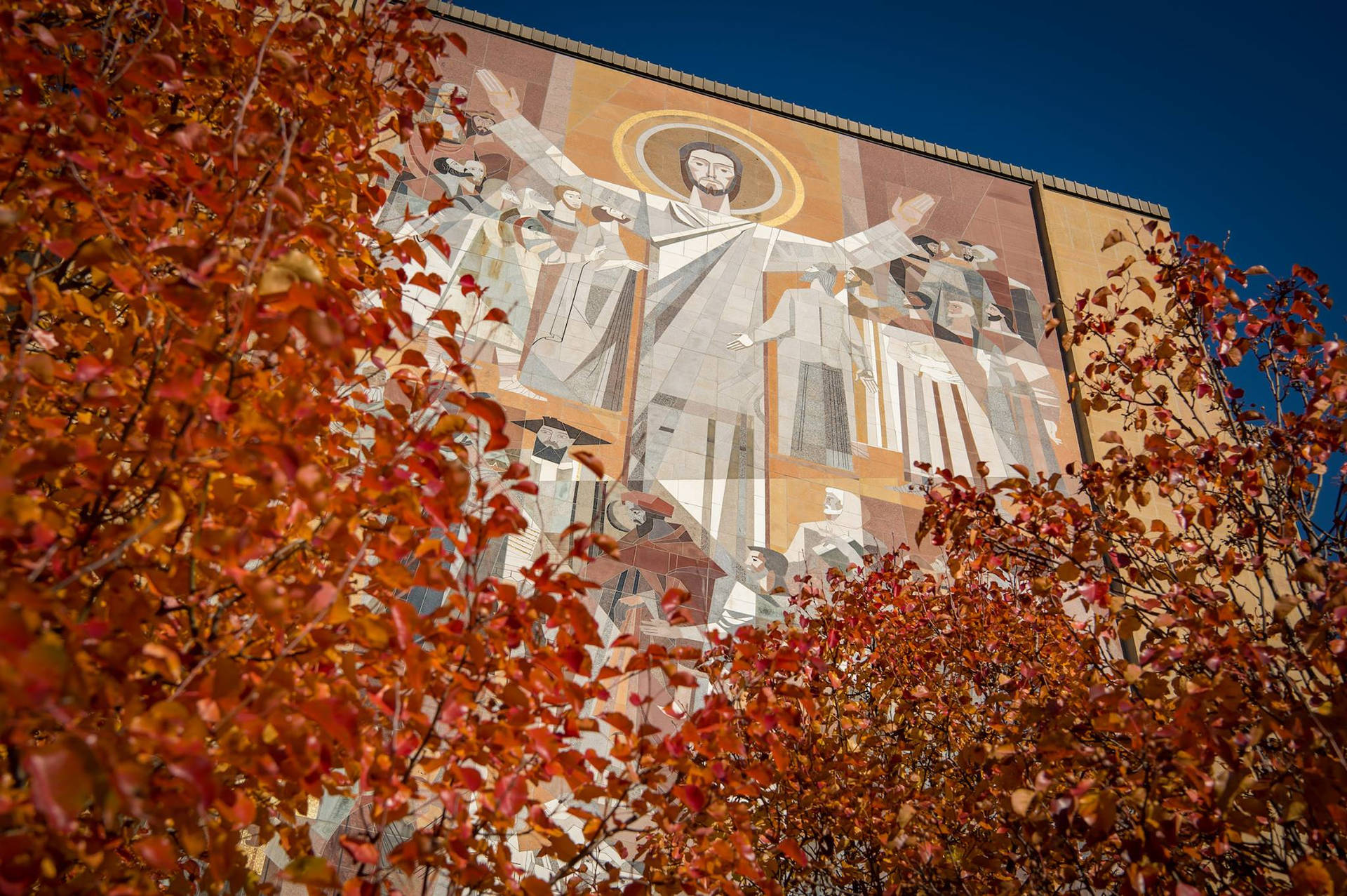 Caption: Iconic Touchdown Jesus Mural At The University Of Notre Dame Background