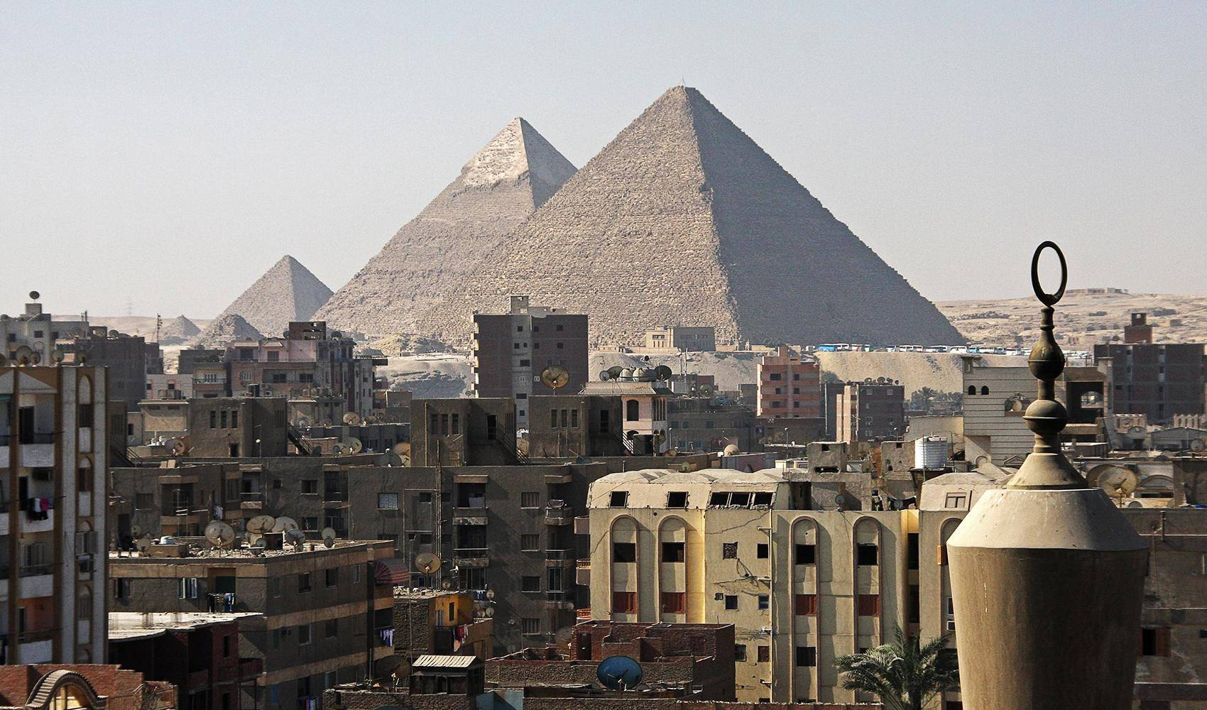 Caption: Iconic View Of Cairo, Egypt Showcasing The Majestic Pyramids Background