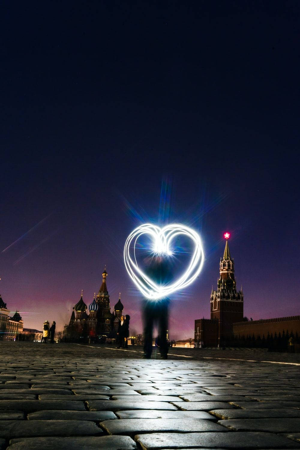 Caption: Illuminated Heart On Indie Phone Background