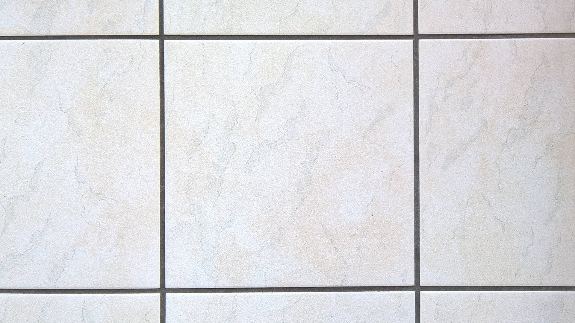 Caption: Impressive Cream-colored Ceramic Floor Tiles Background