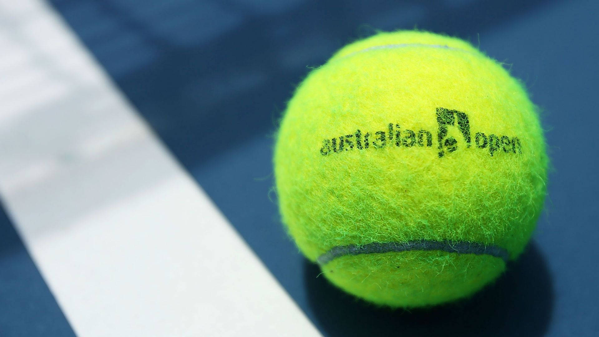 Caption: Intense Focus: Close Shot Of Tennis Ball At Australian Open Background