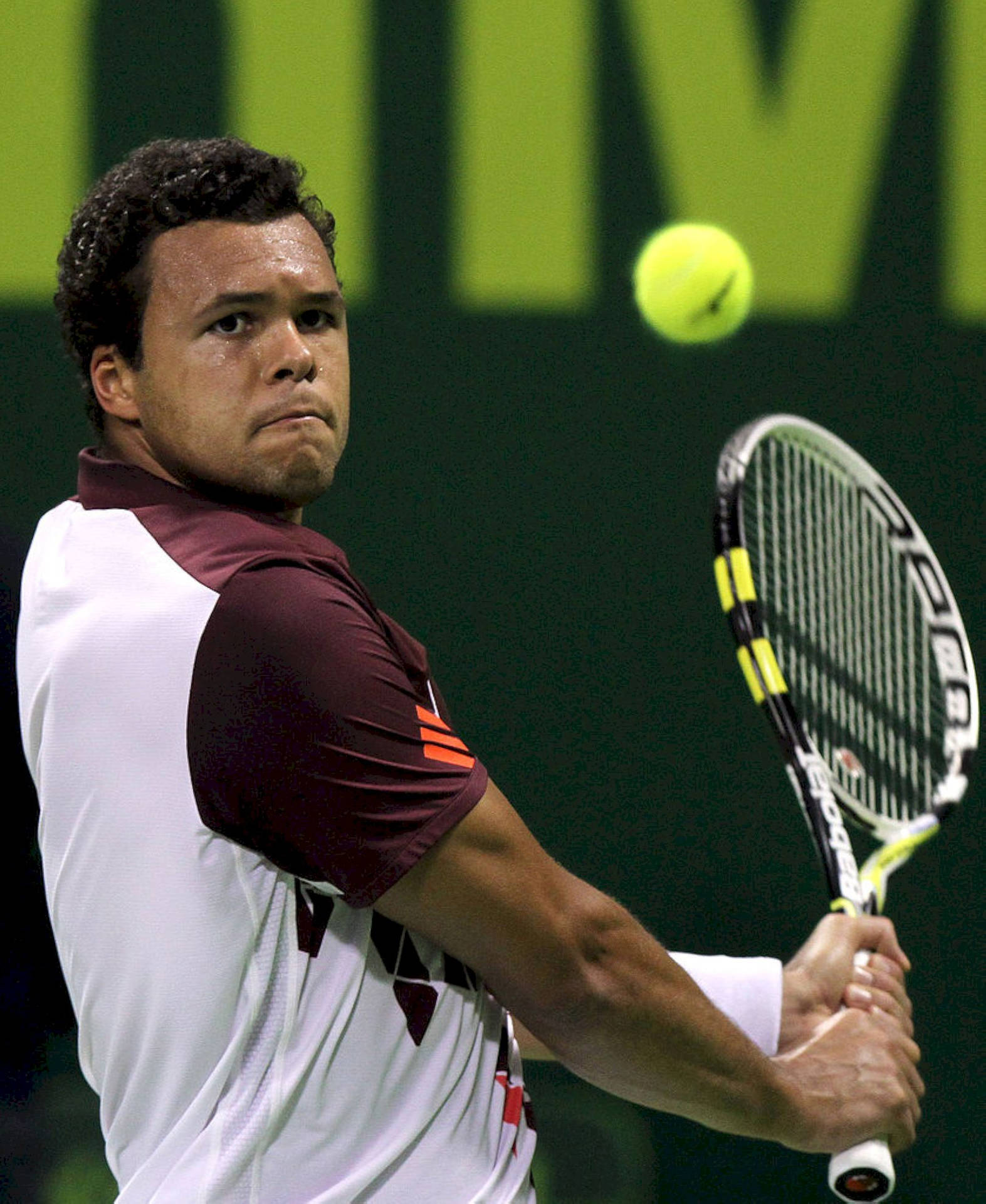 Caption: Intense Jo-wilfried Tsonga In Action. Background