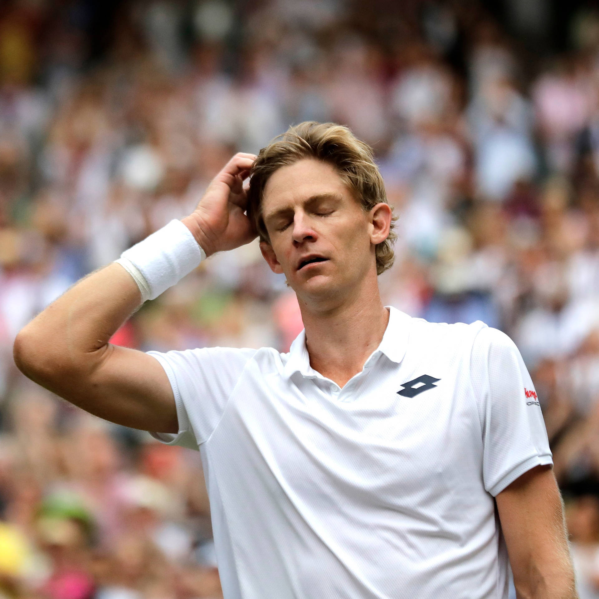 Caption: Intense Kevin Anderson With Eyes Closed In Thought Background