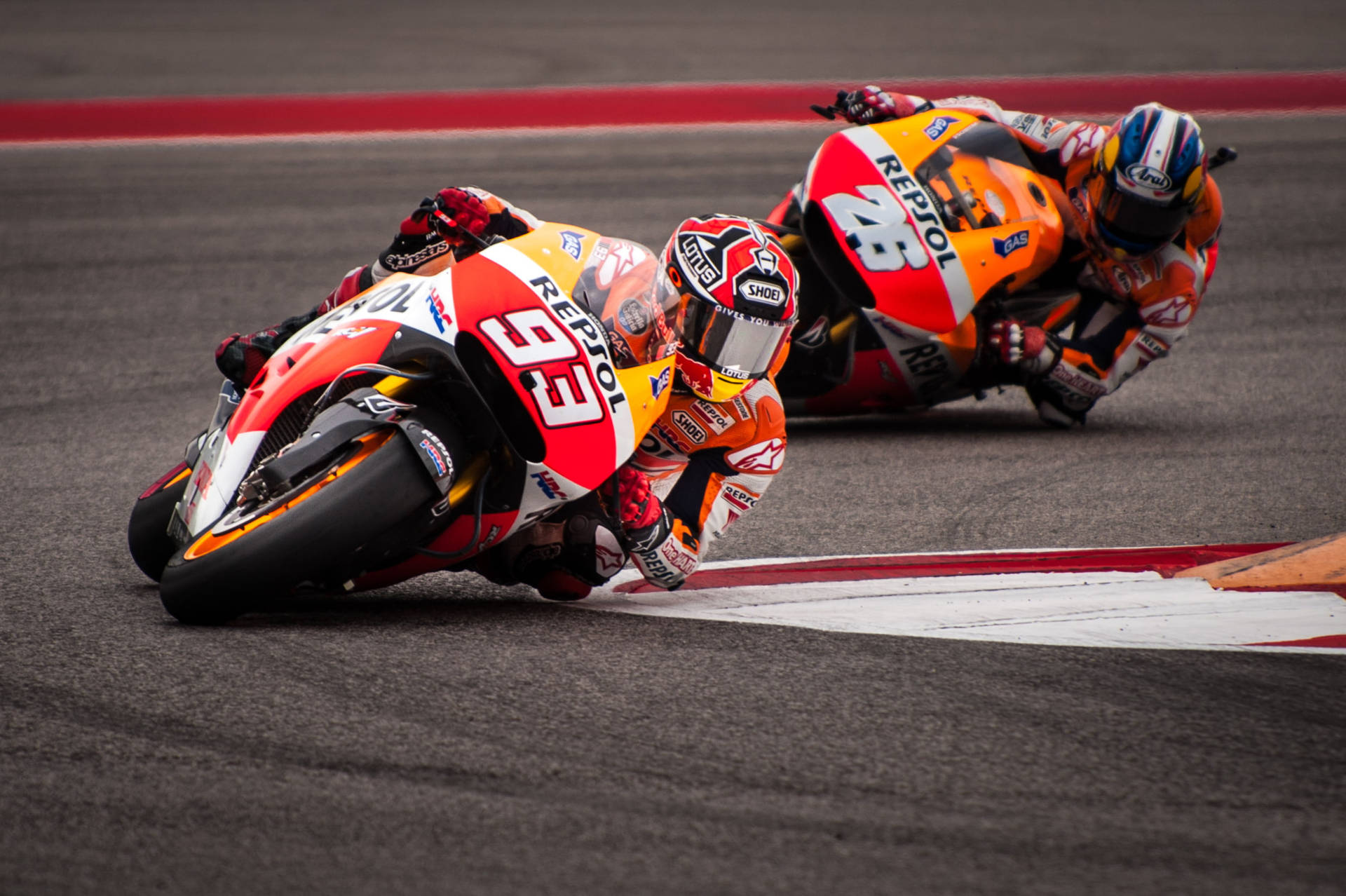 Caption: Intense Motogp Race With Marquez And Pedrosa Background