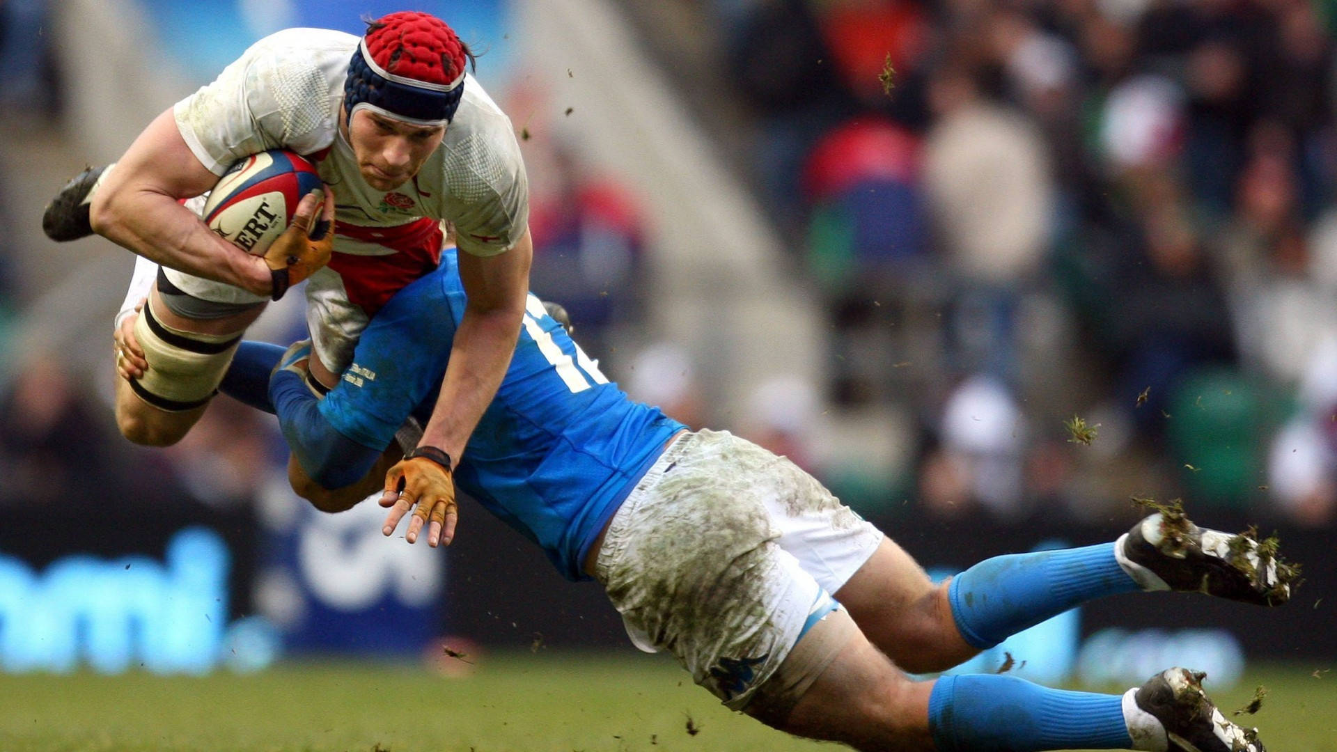 Caption: Intense Rugby Action - The England Rugby Tackle