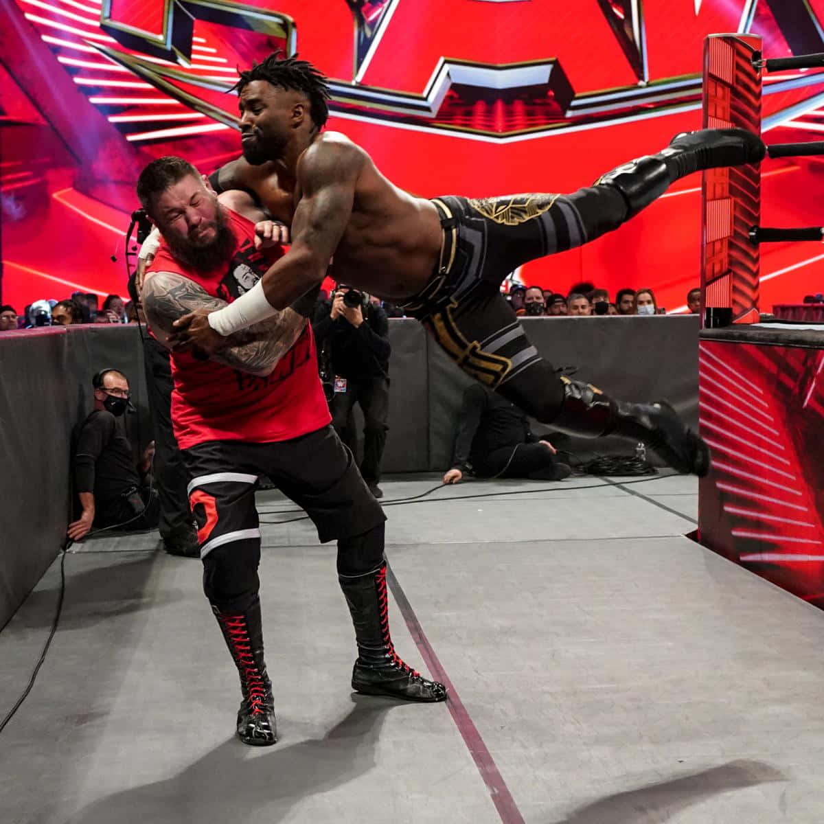 Caption: Intense Showdown Between Cedric Alexander And Kevin Owens At Wwe Raw Background
