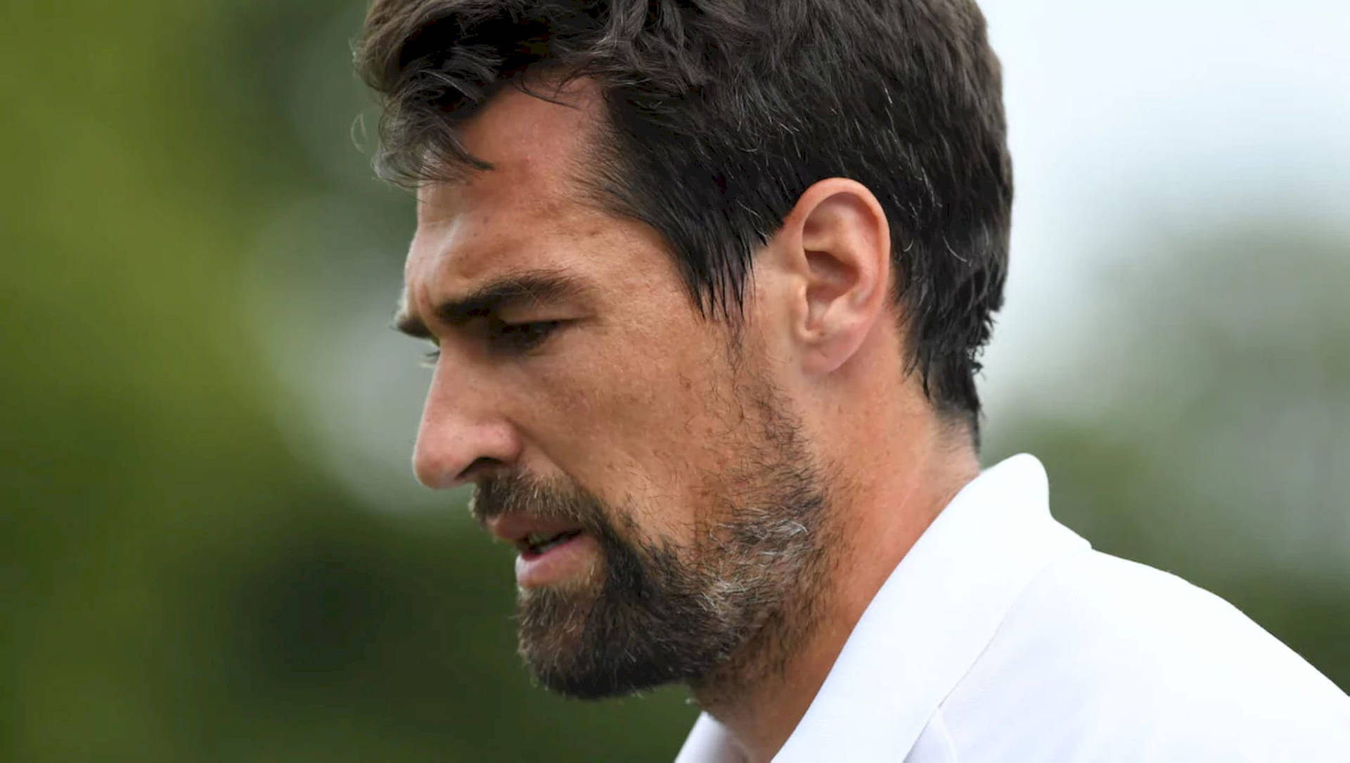 Caption: Intense Side Profile Of Jeremy Chardy In Action Background