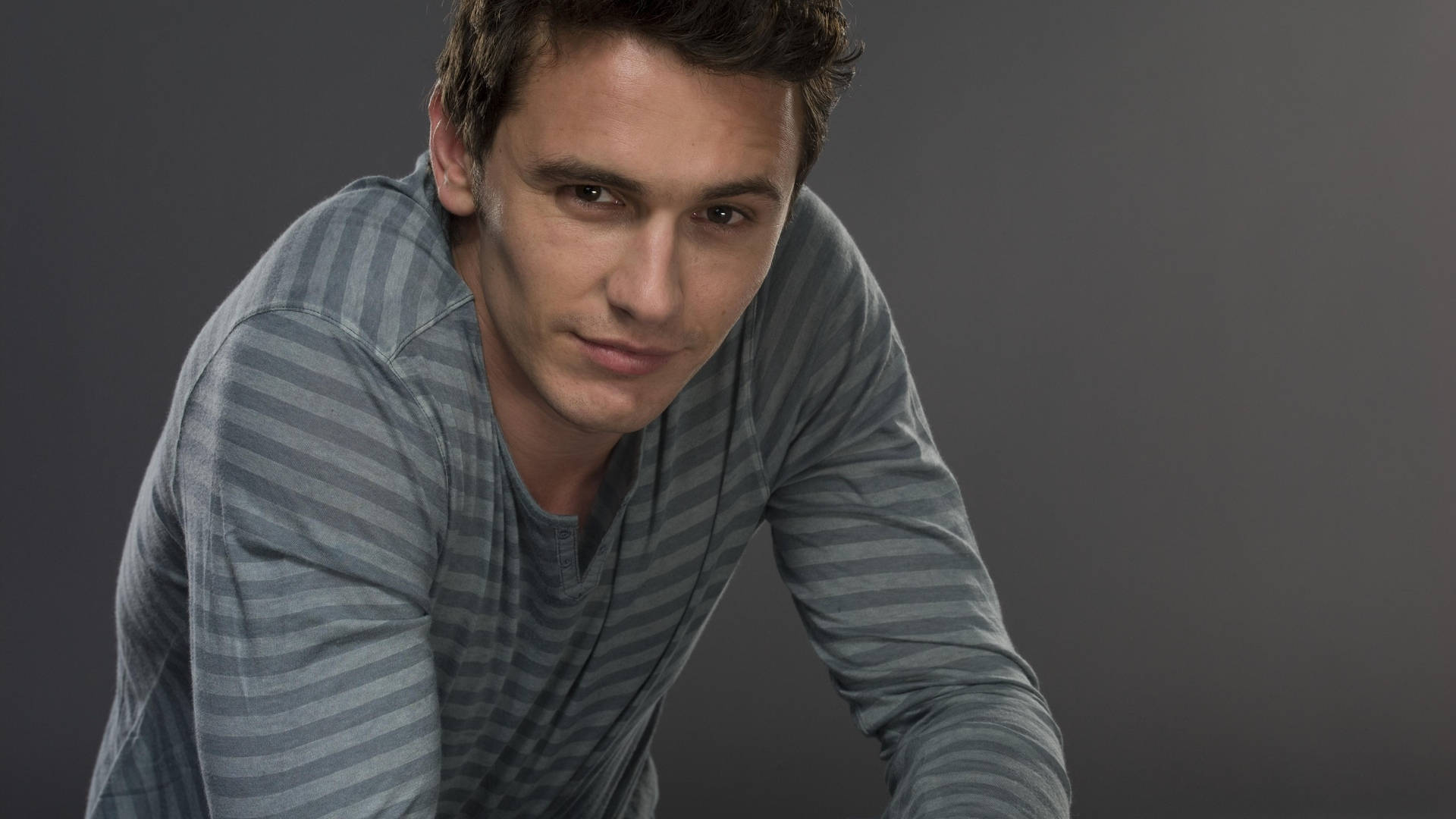 Caption: James Franco In A Captivating Grey Photoshoot Background