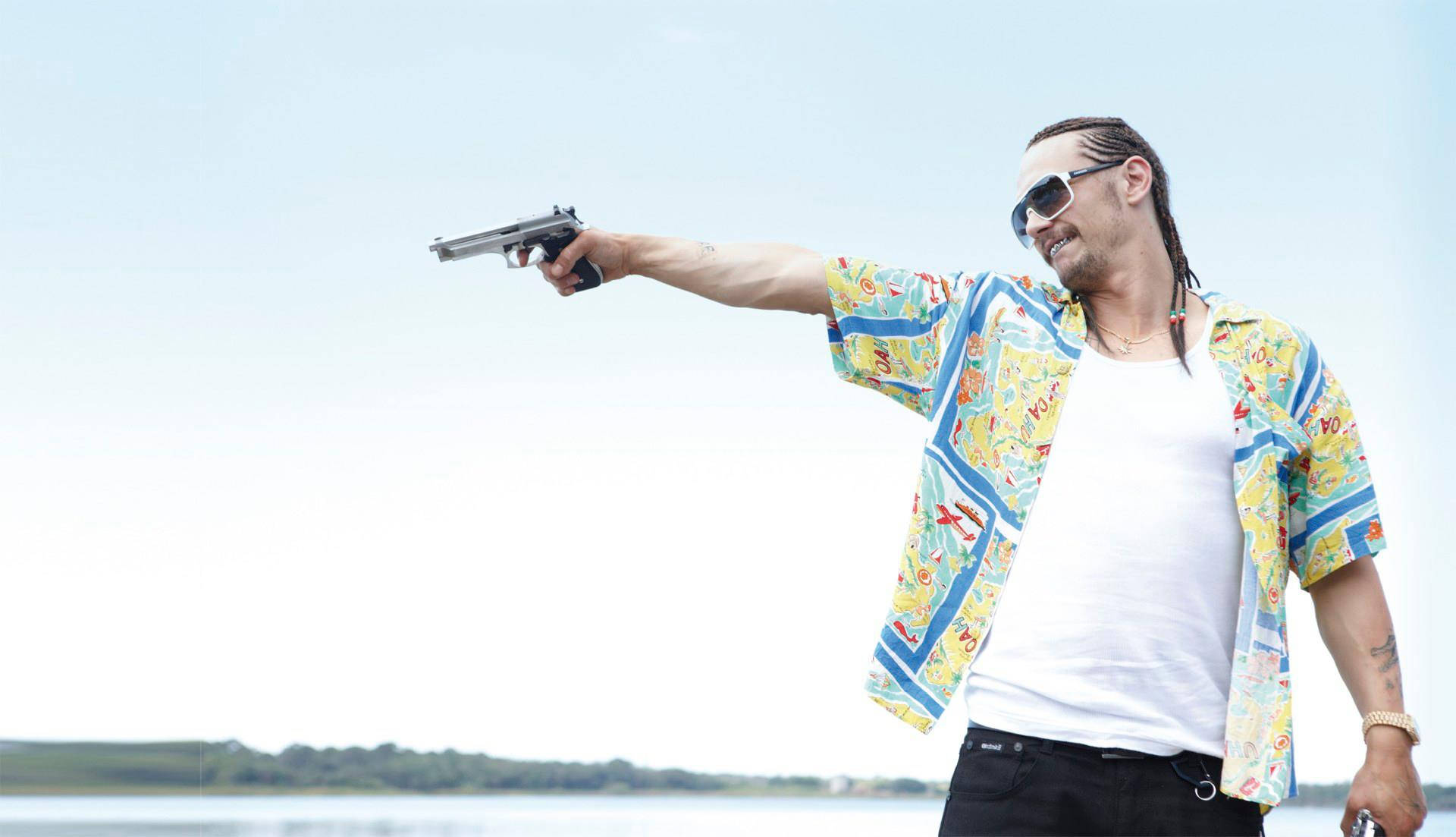 Caption: James Franco Posing In Character From His Movie Spring Breakers Background