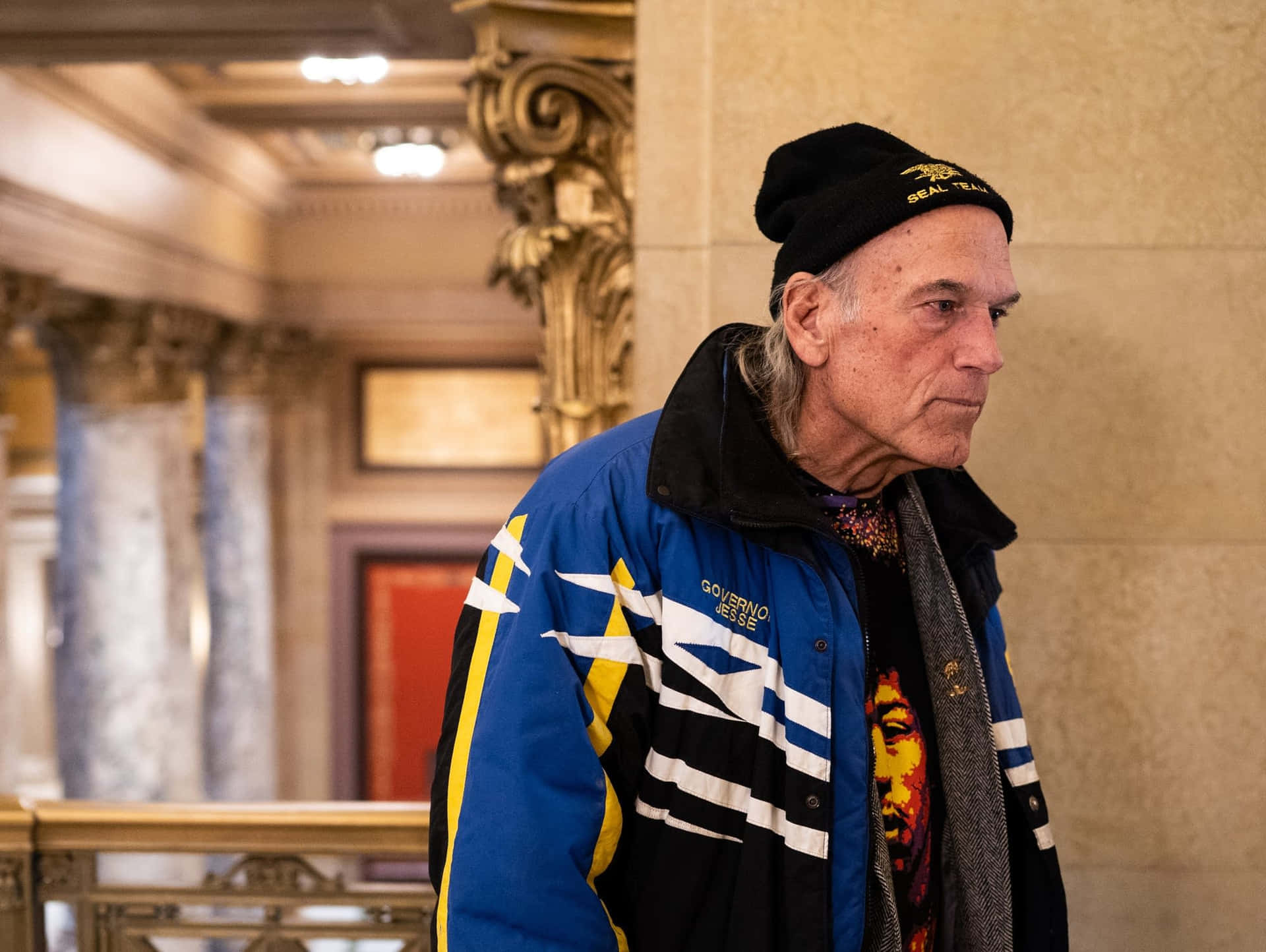 Caption: Jesse Ventura - The Vigorous Wrestler Turned Politician Background