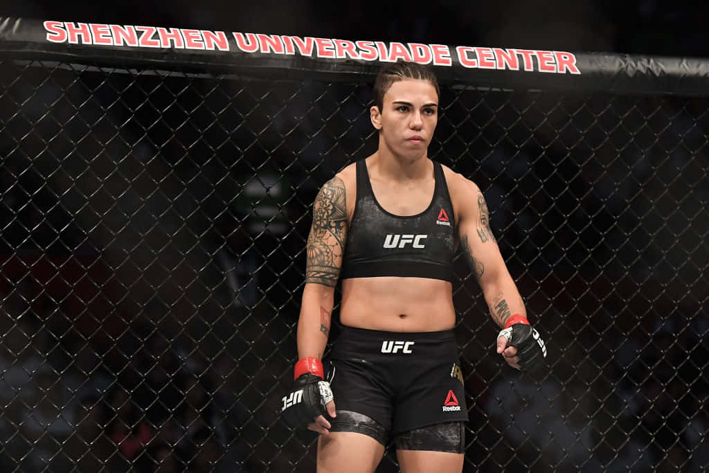 Caption: Jéssica Andrade Unbeatable In The Octagon Background