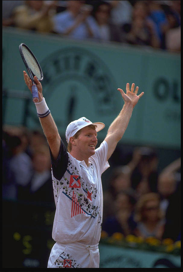 Caption: Jim Courier Celebrating A Tennis Victory Background