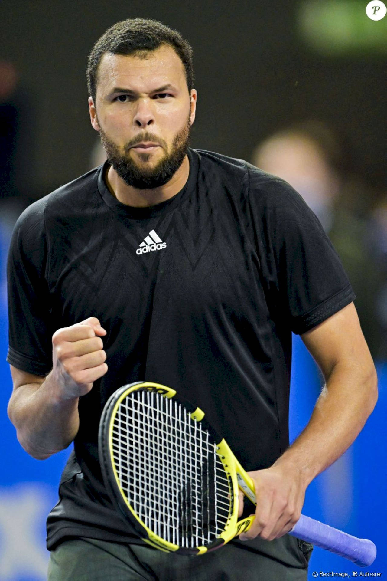 Caption: Jo-wilfried Tsonga Celebrating Victorious Moment Background